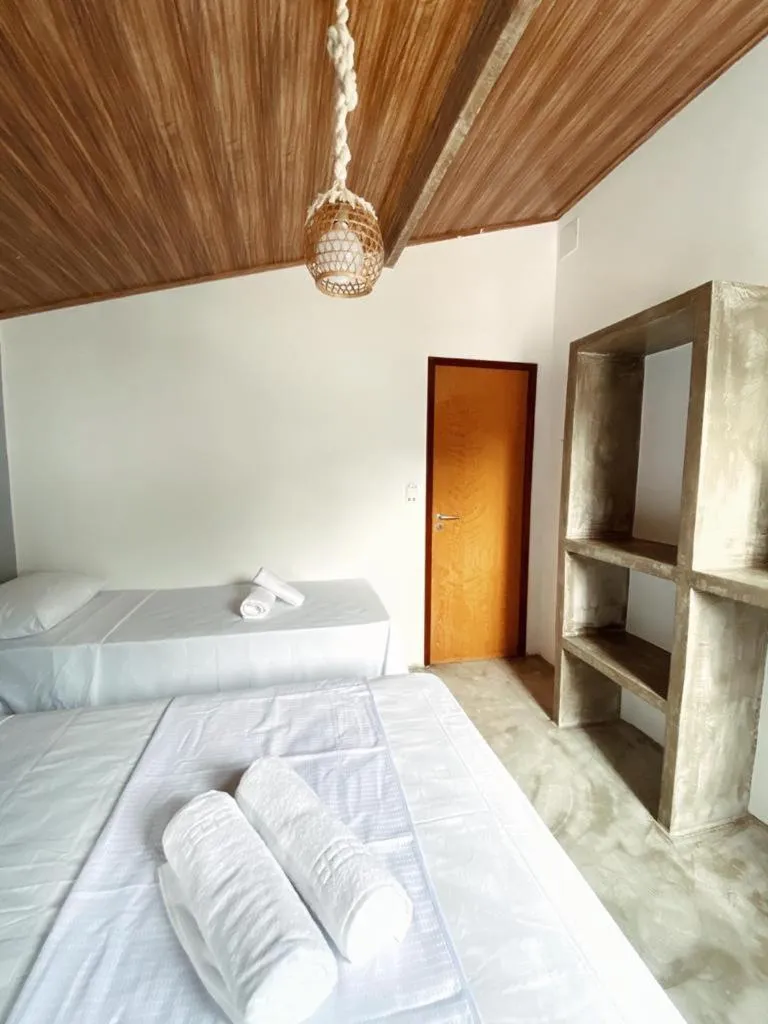 Bed in Pousada Primeira Praia Suítes