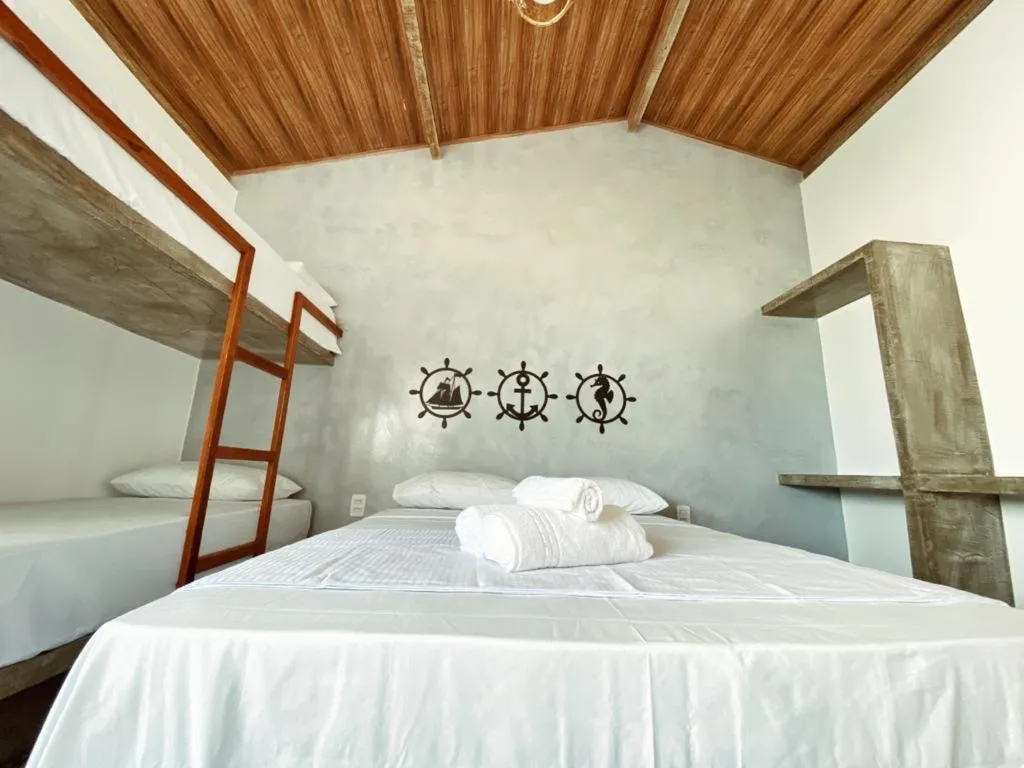 Bed in Pousada Primeira Praia Suítes