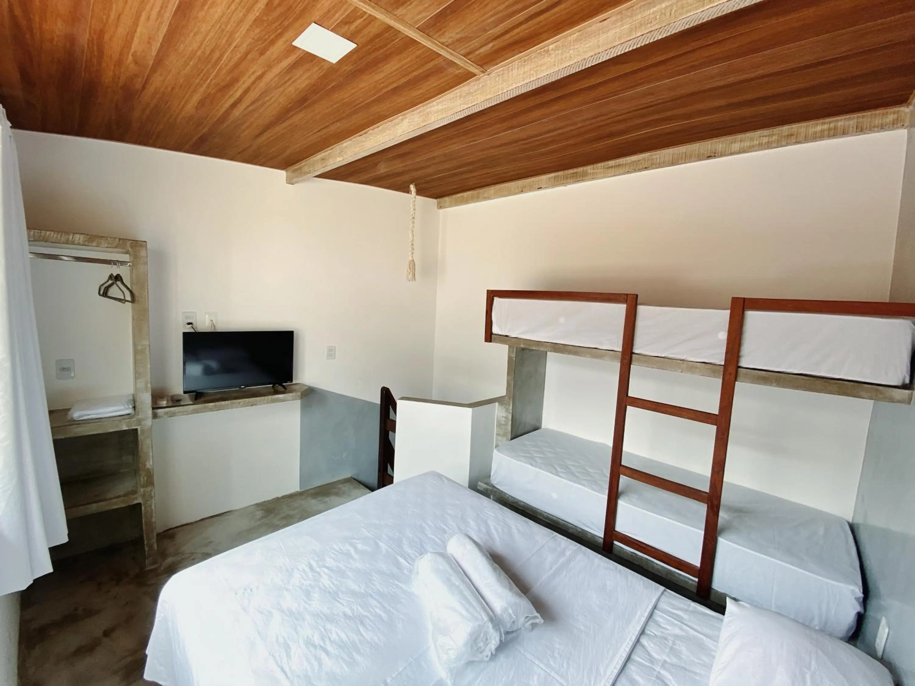 Bed in Pousada Primeira Praia Suítes