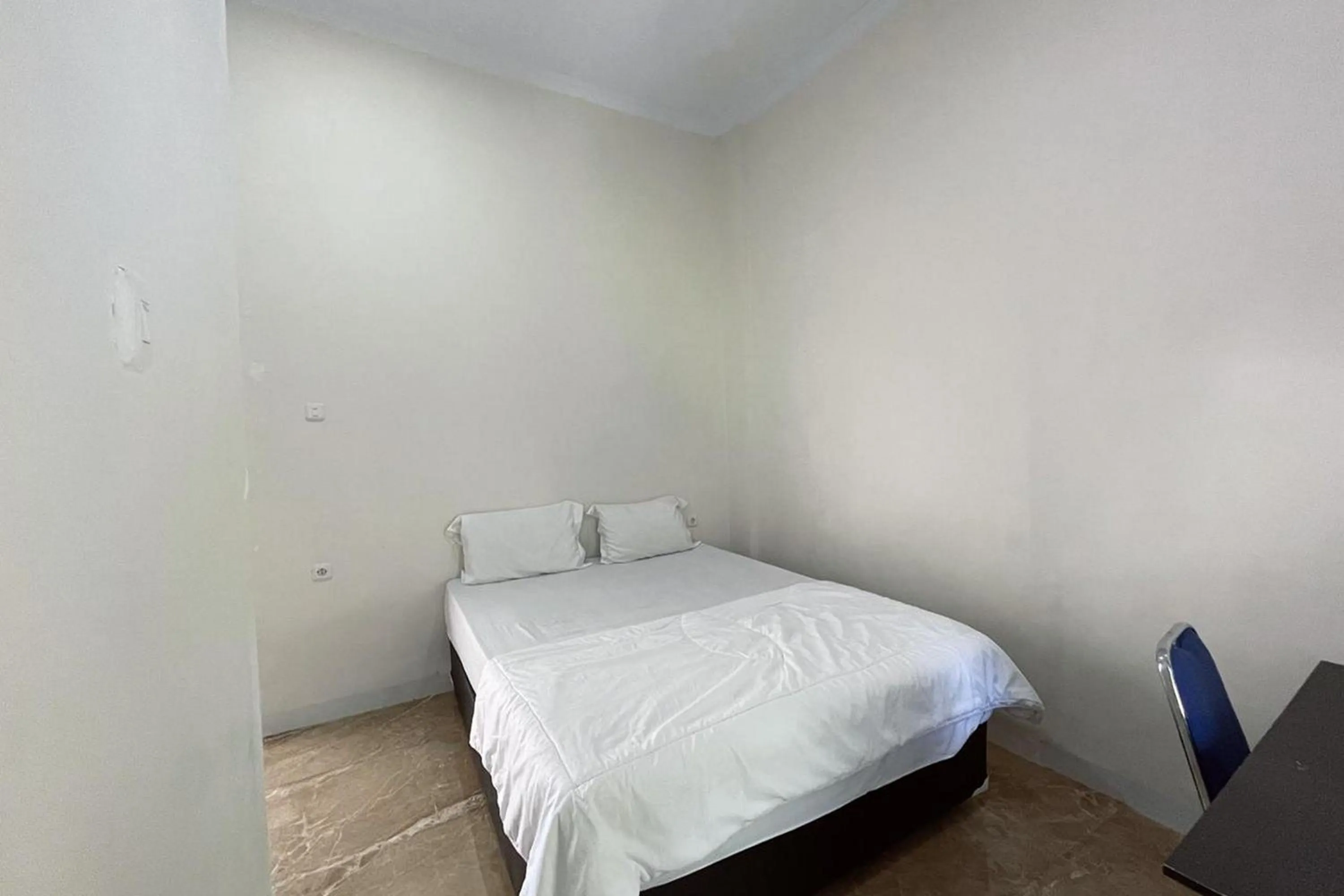 Bed in Wisma Maestro Toraja Mitra RedDoorz