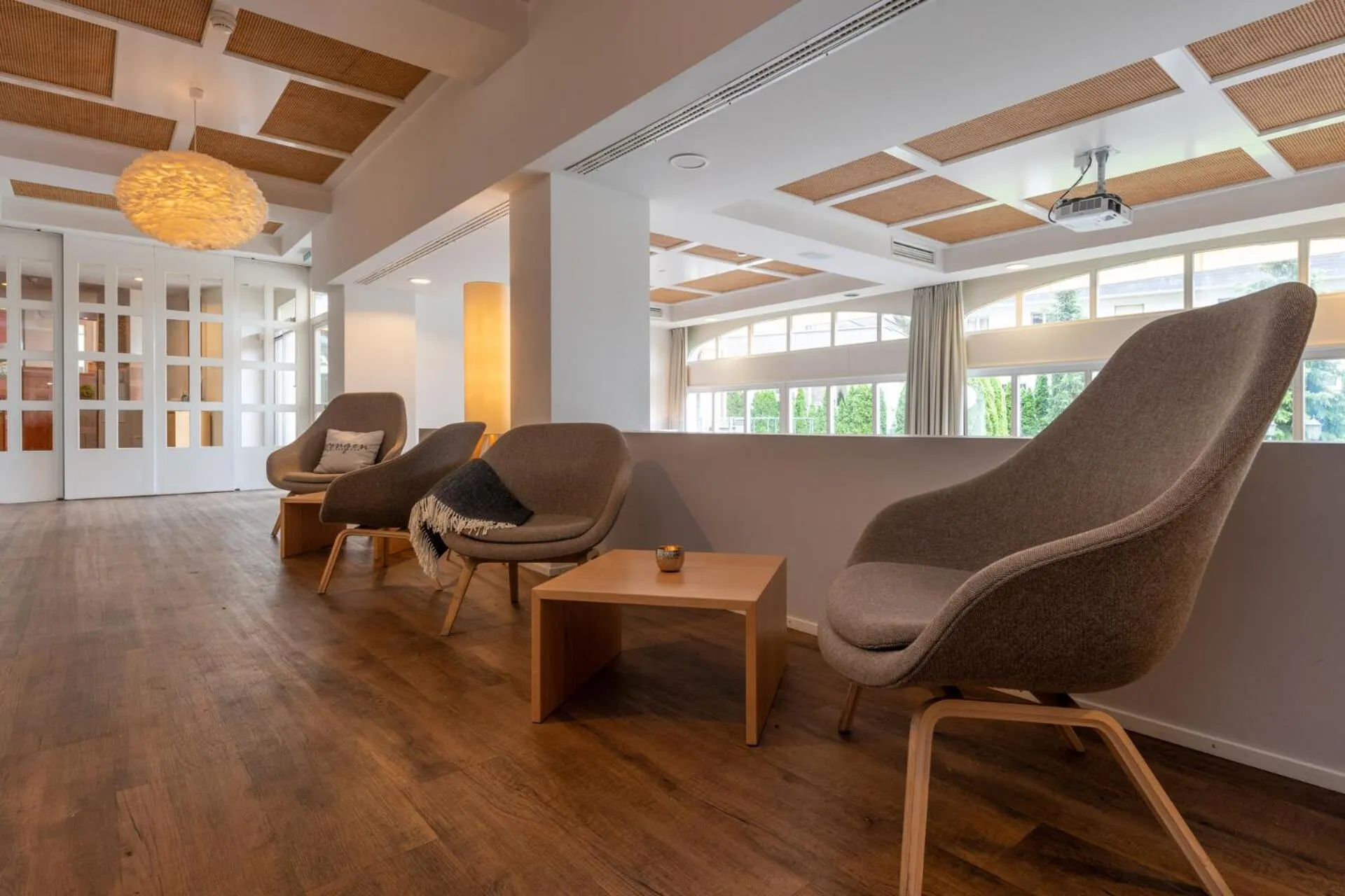 Communal lounge/ TV room in Hotel Victoria Lauberhorn Wengen, a Faern Collection Hotel