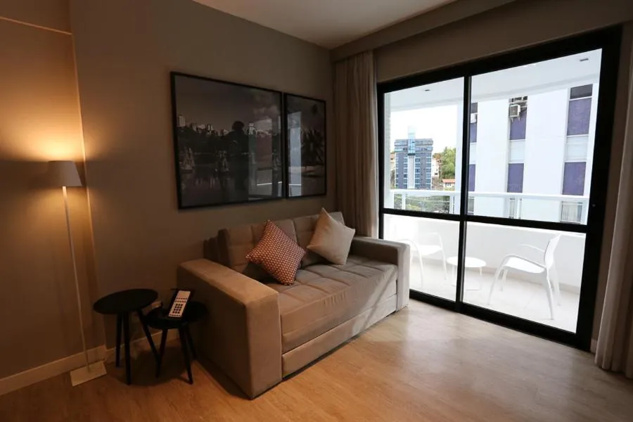Living room in Astron Suítes Mondial Salvador by Nobile