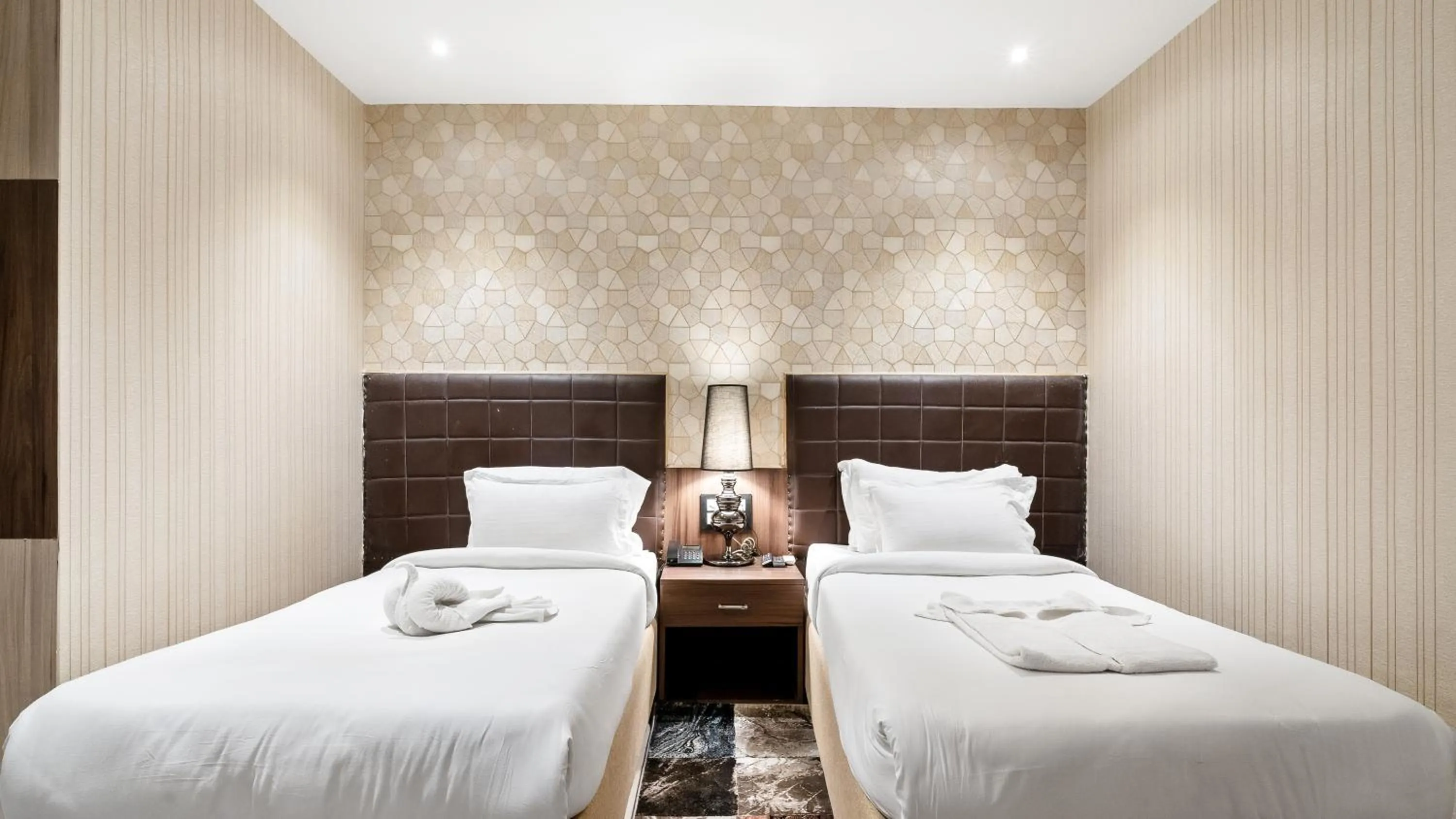 Bed in Niranjana Hotel Bodhgaya