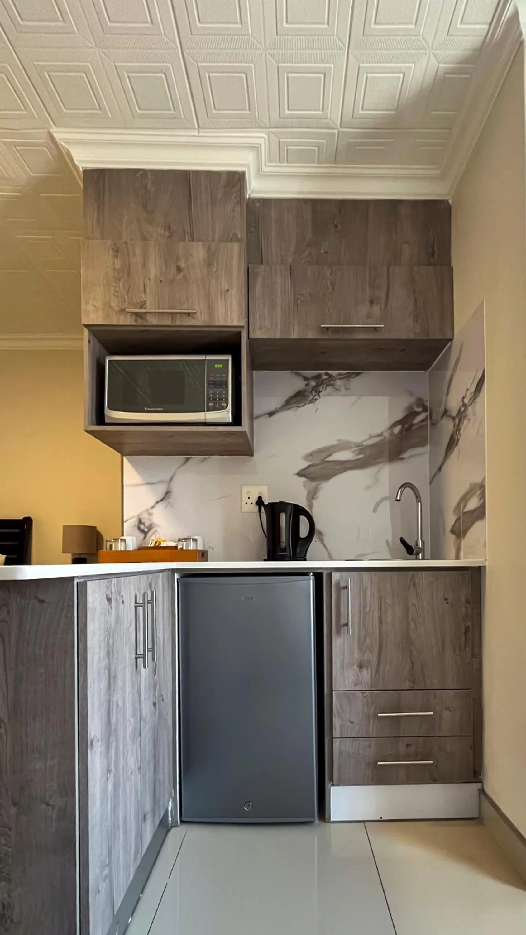 Kitchen or kitchenette in Regal Inn PMBurg