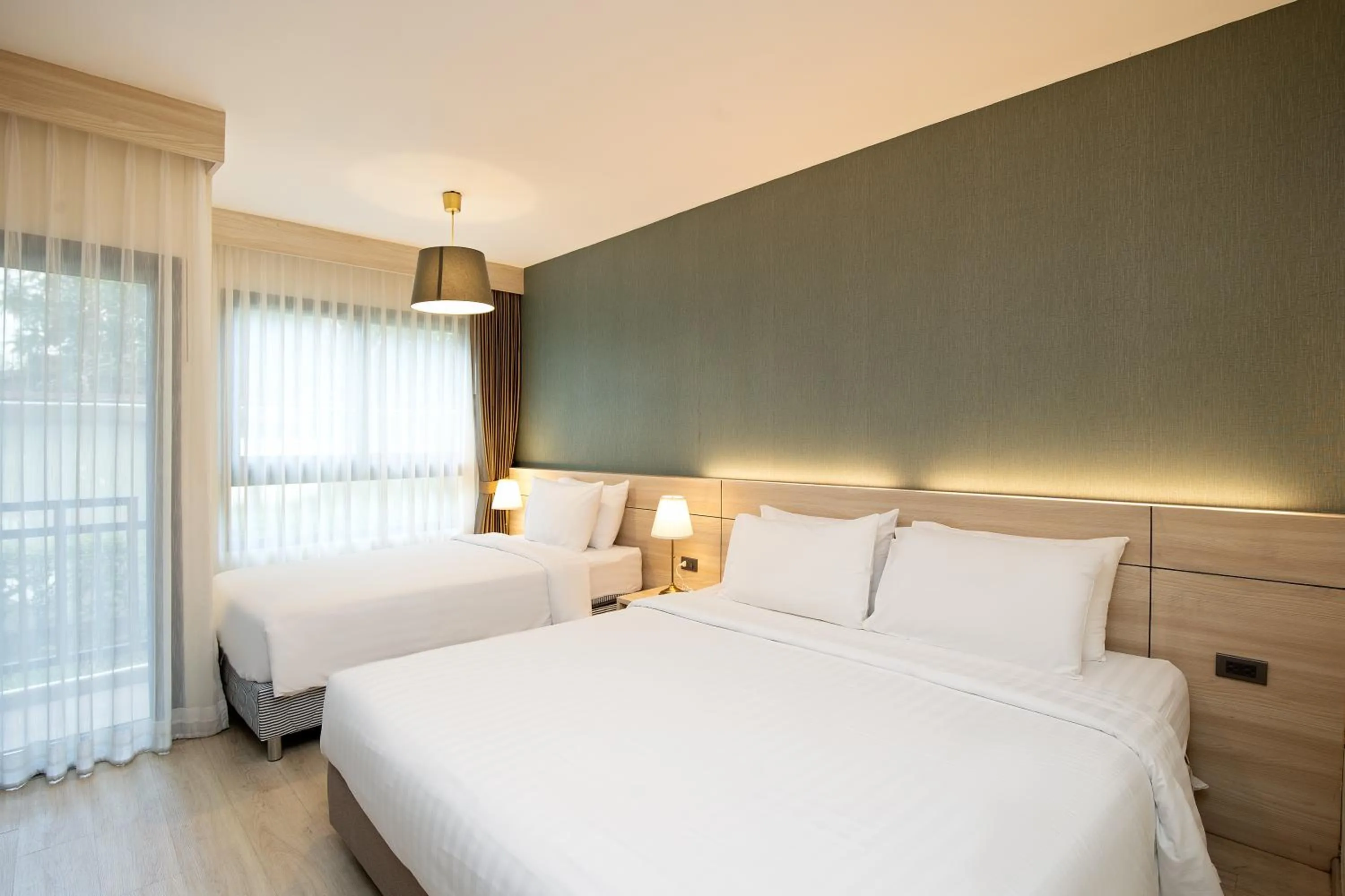 Bed in Amanah Bangkok Hotel