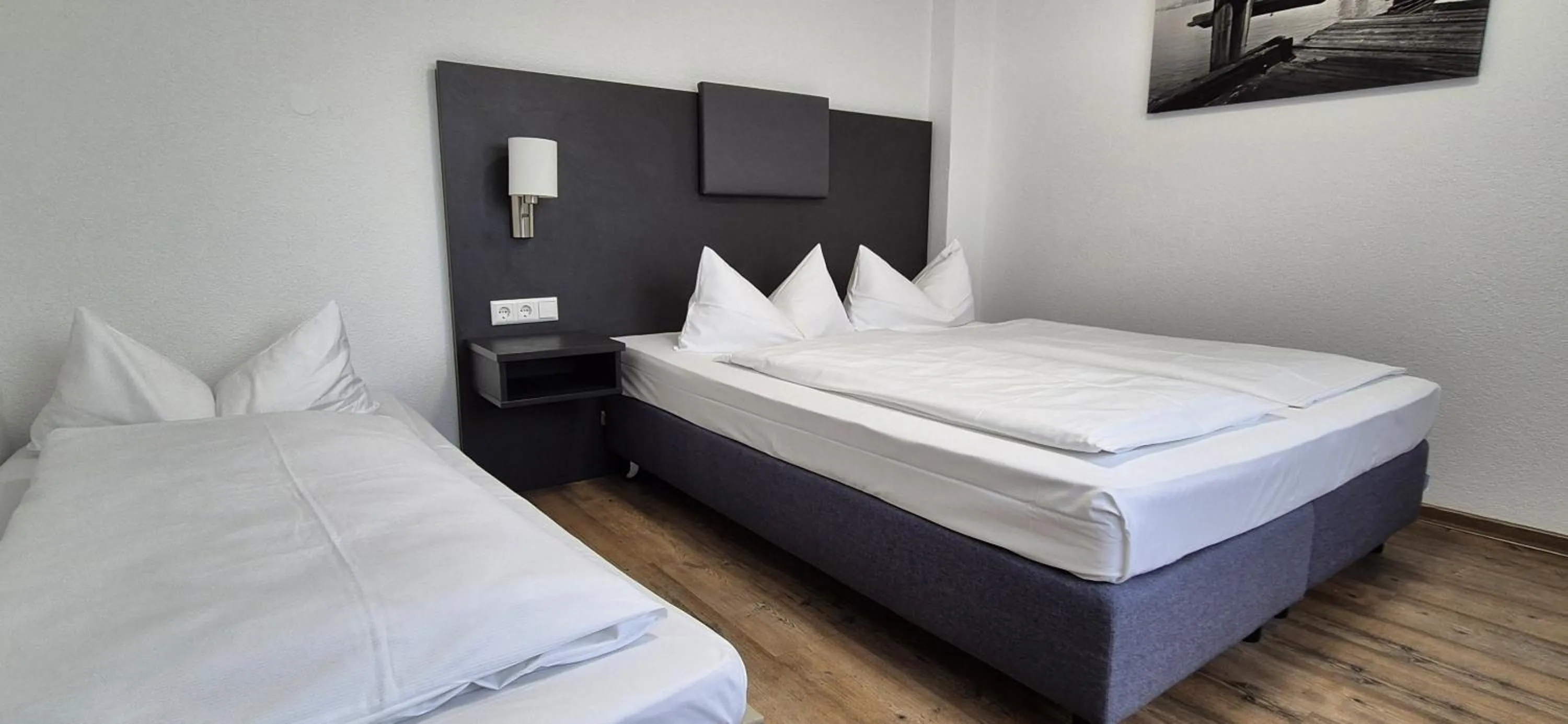 Photo of the whole room, Bed in Melvi Hotel Göppingen