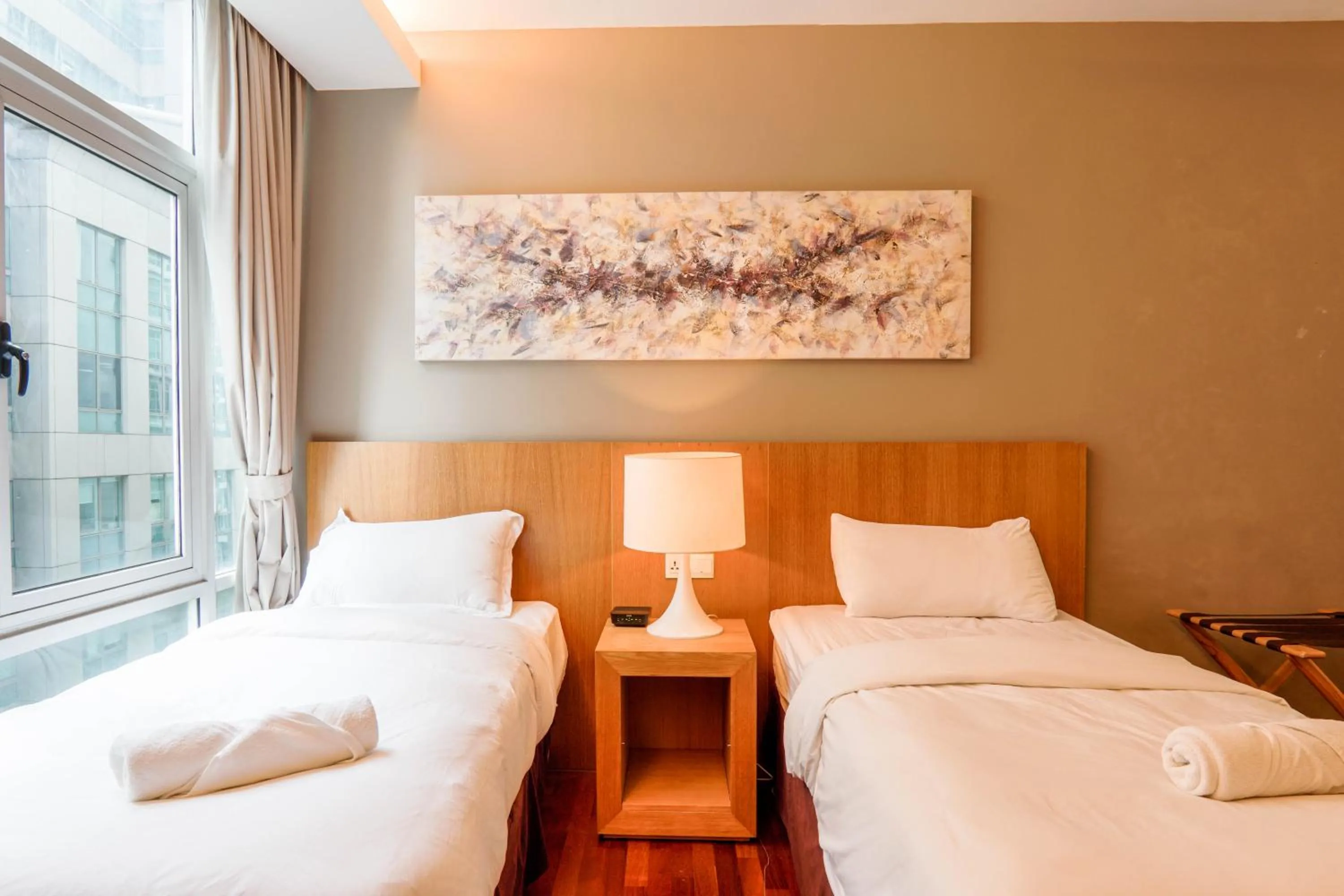 Bed in Lot 163 at Cormar Suites by Airhost