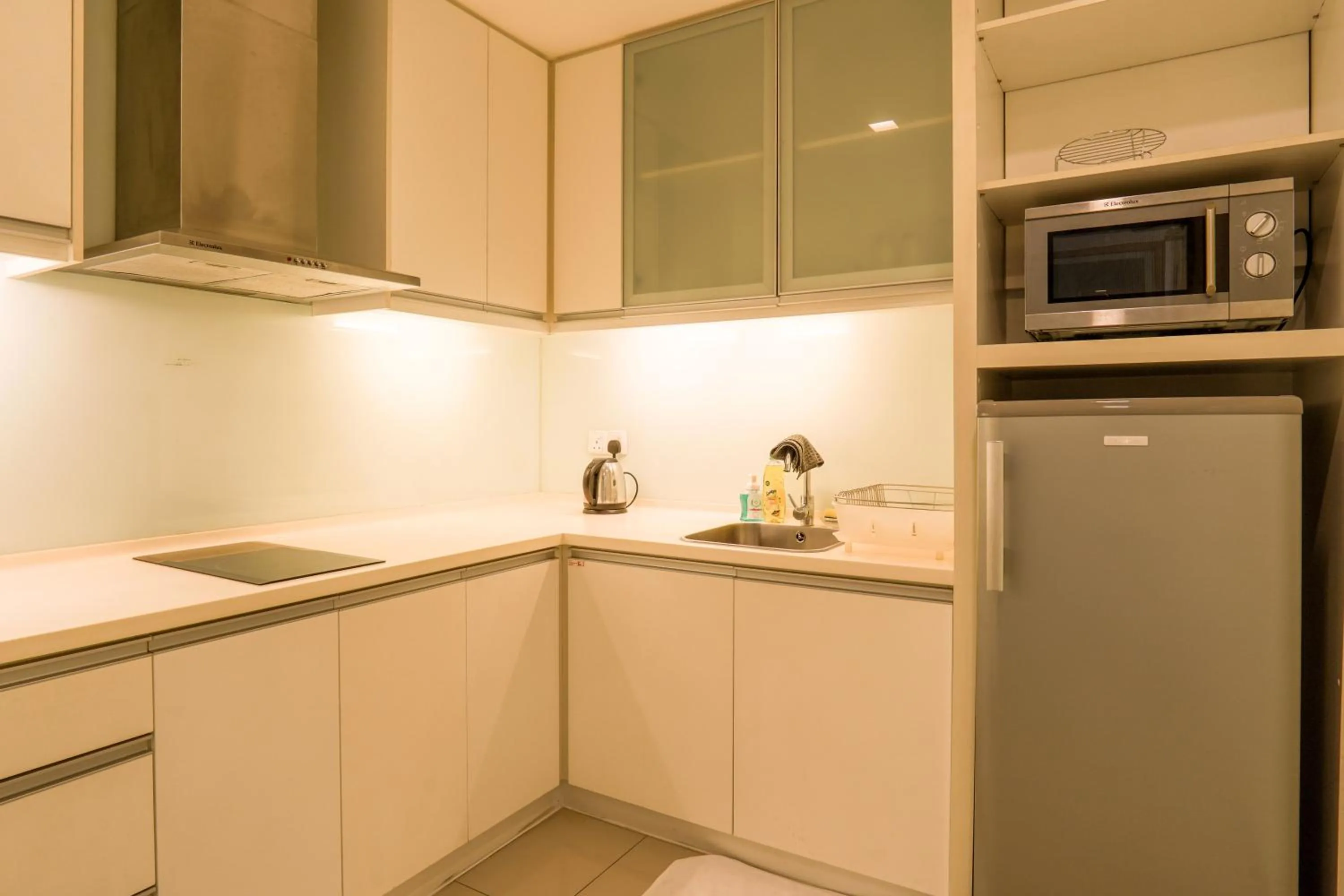 Kitchen or kitchenette in Lot 163 at Cormar Suites by Airhost