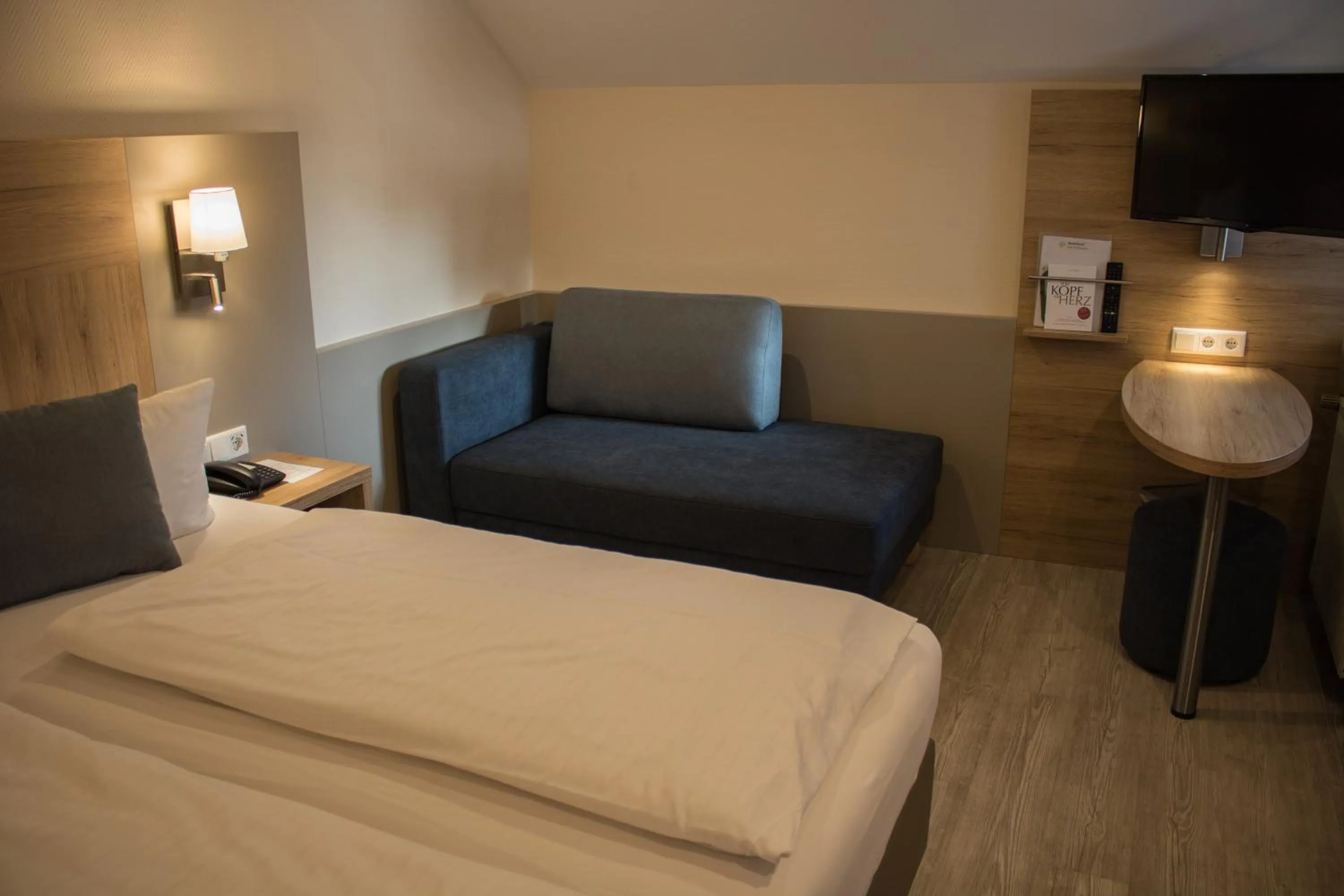 Seating area, Bed in Hotel Rosenbusch