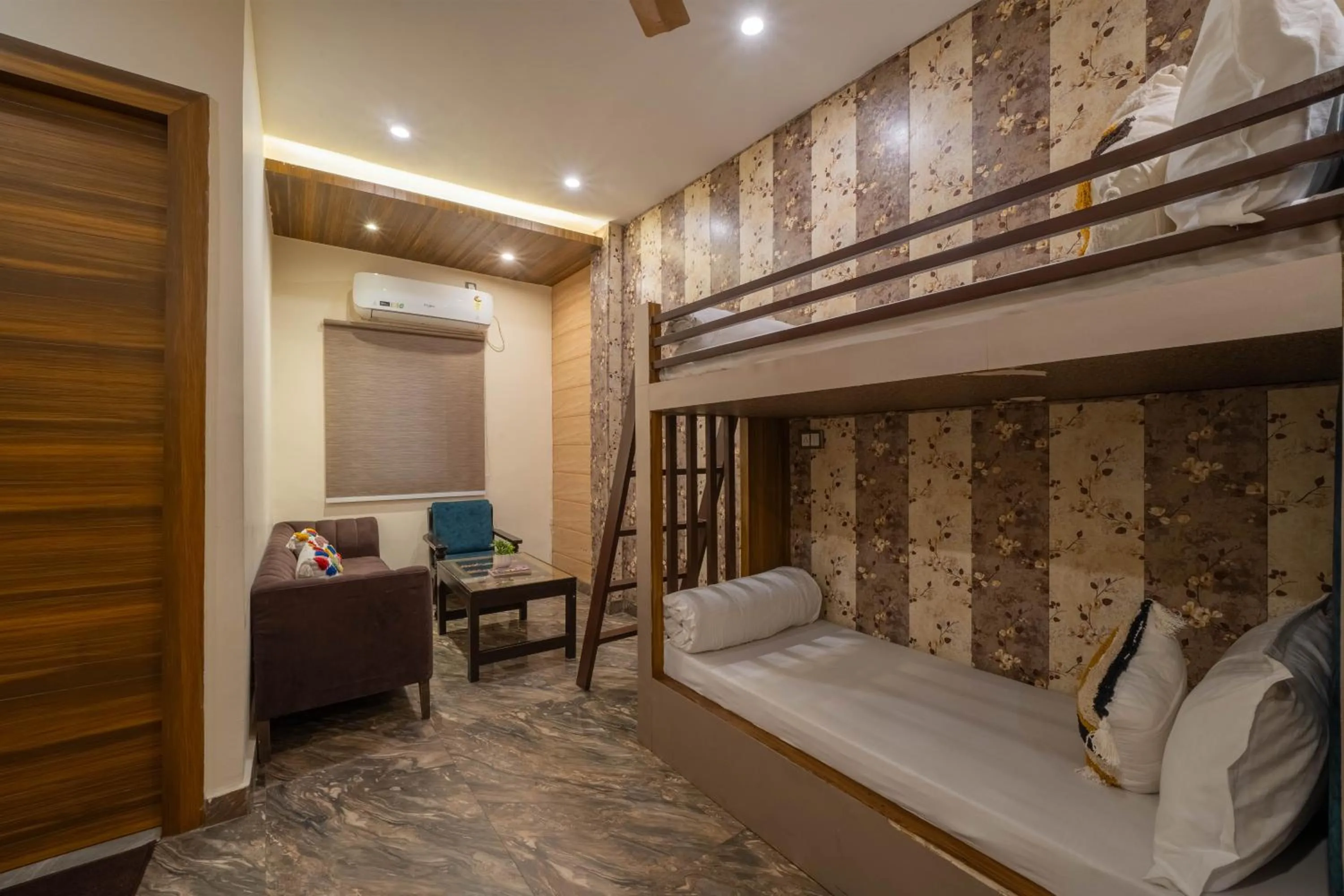 Seating area, Bed in Perfectstayz Premium Ganga Heights - Ganga View rooftop cafe