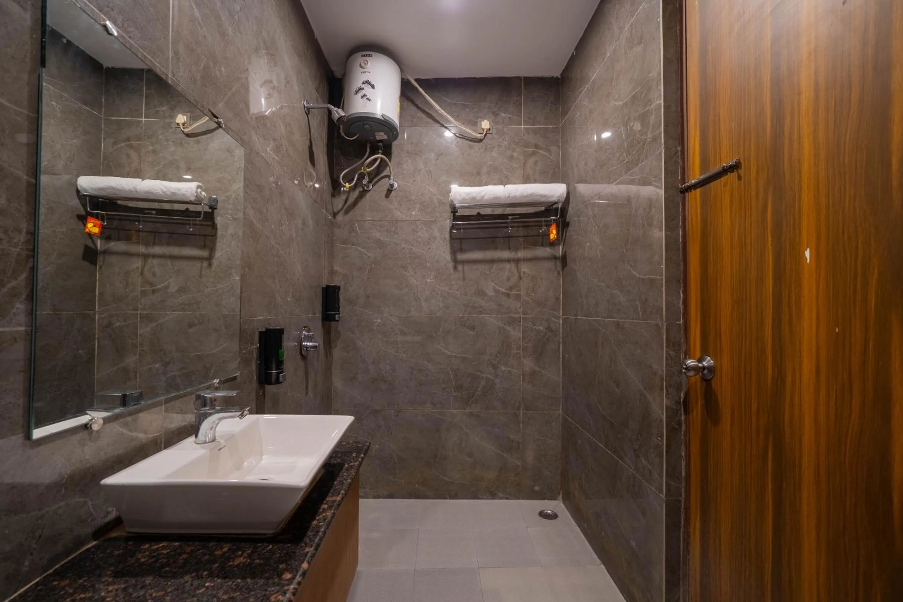 Bathroom in Perfectstayz Premium Ganga Heights - Ganga View rooftop cafe