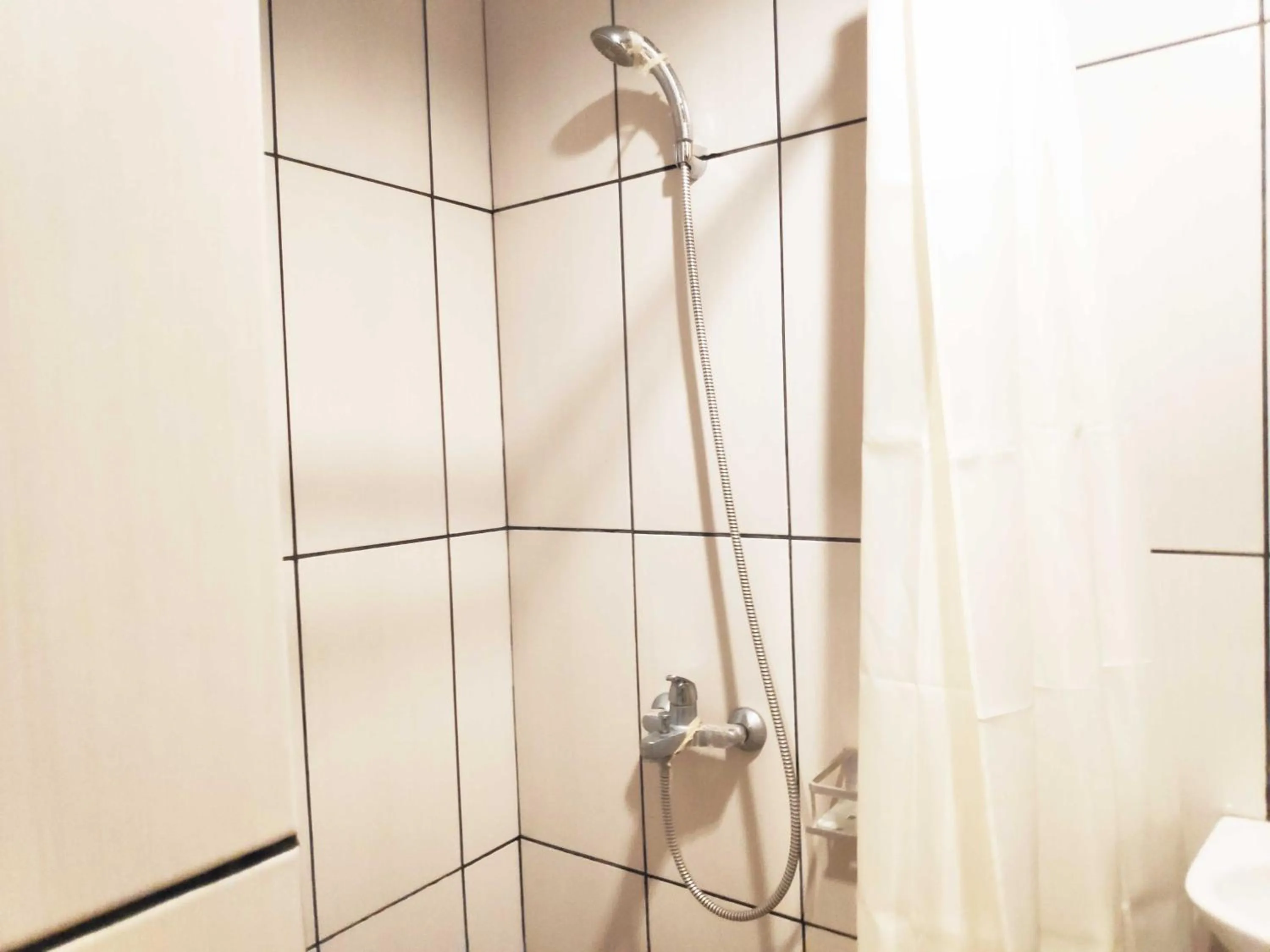Bathroom in Apartemen Grand Kamala Lagoon by 21 Room - Netflix