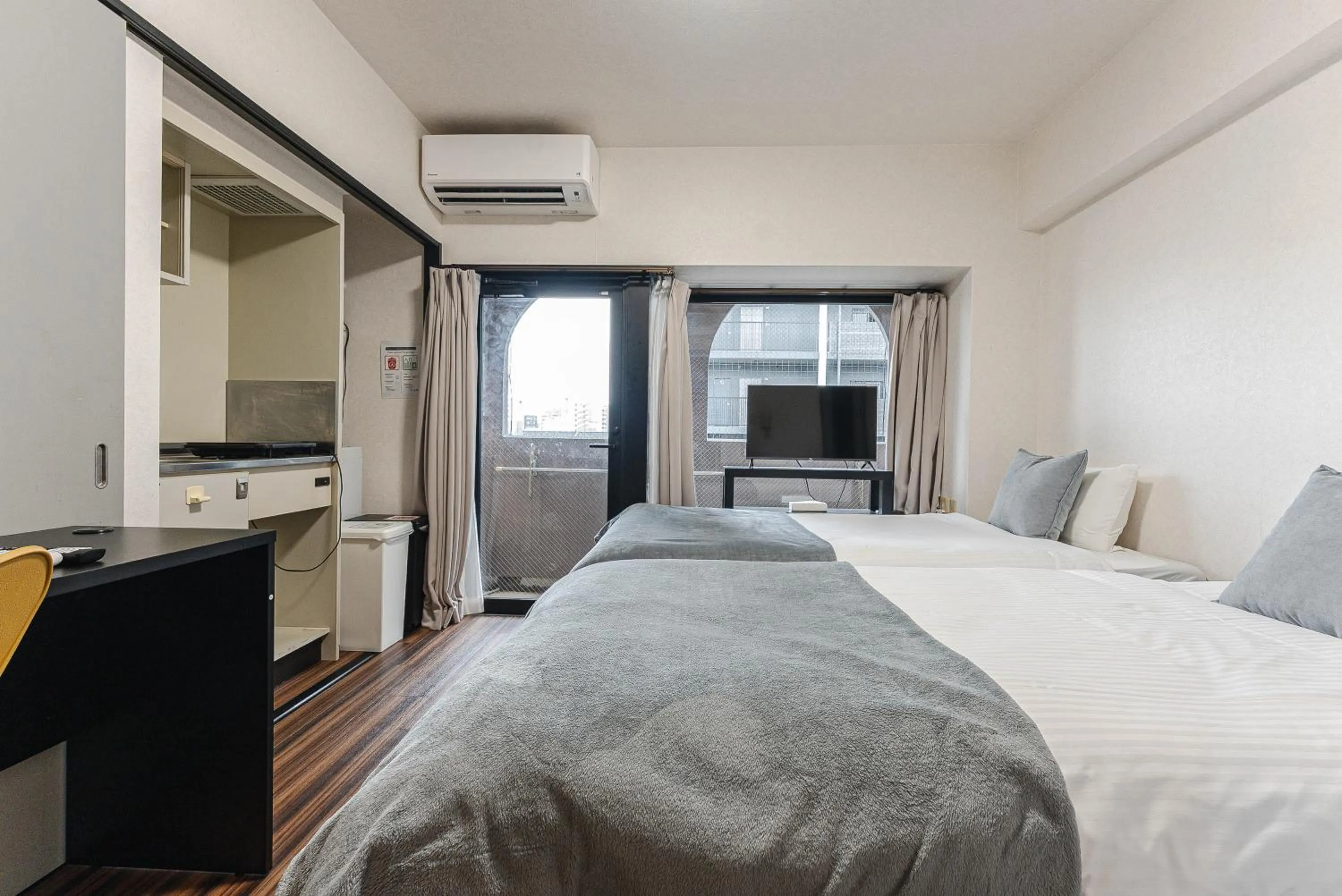 Bed in SUMIYOSHI APARTMENT Hotel 住吉アパートメントホテル