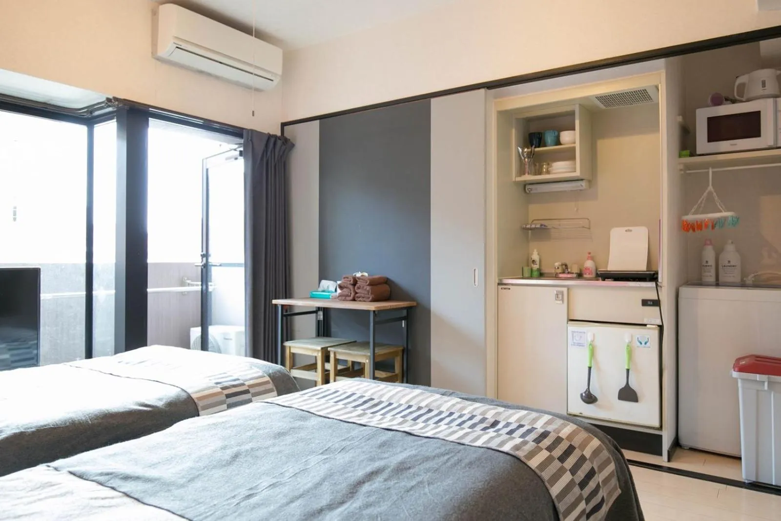 Bed in SUMIYOSHI APARTMENT Hotel 住吉アパートメントホテル