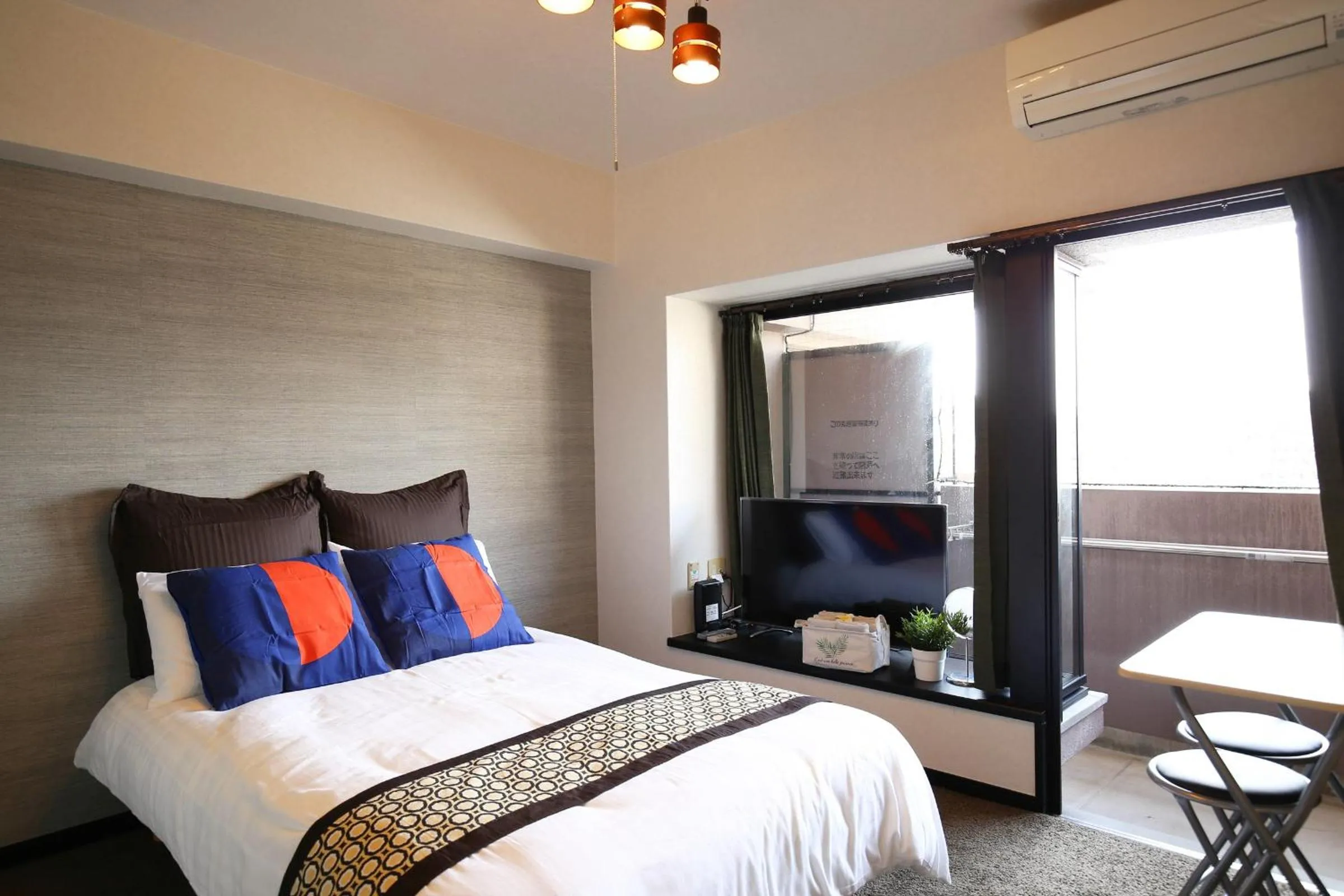 Bed in SUMIYOSHI APARTMENT Hotel 住吉アパートメントホテル