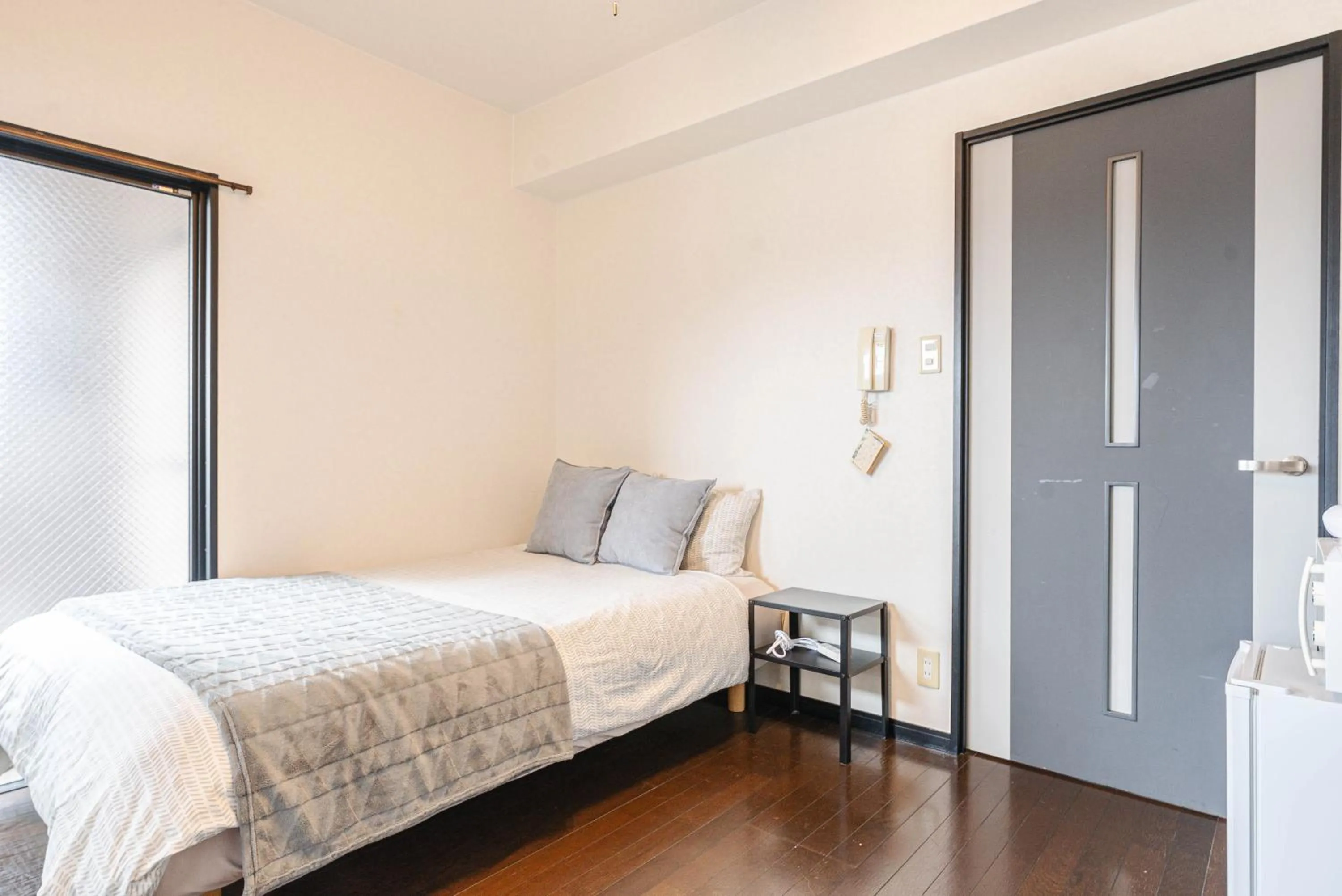 Bed in SUMIYOSHI APARTMENT Hotel 住吉アパートメントホテル