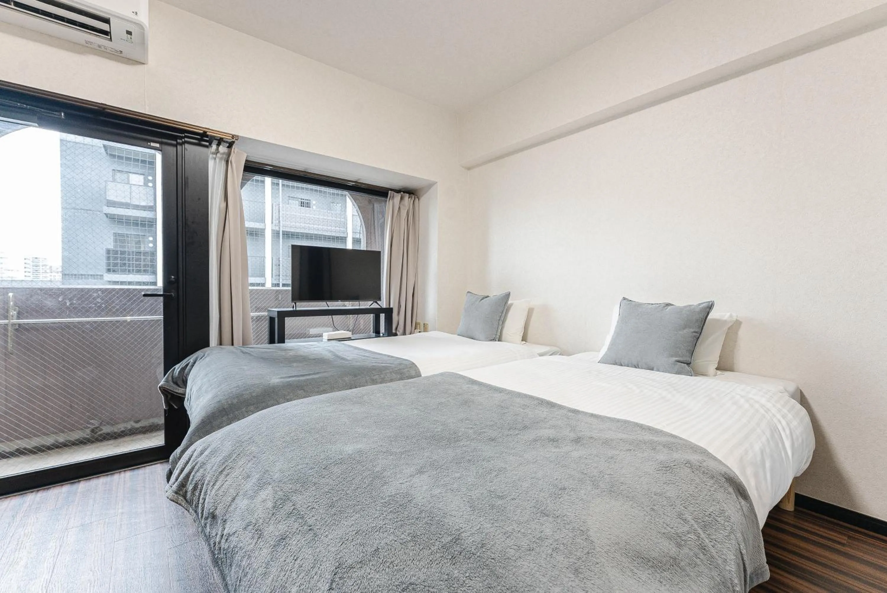 Bed in SUMIYOSHI APARTMENT Hotel 住吉アパートメントホテル