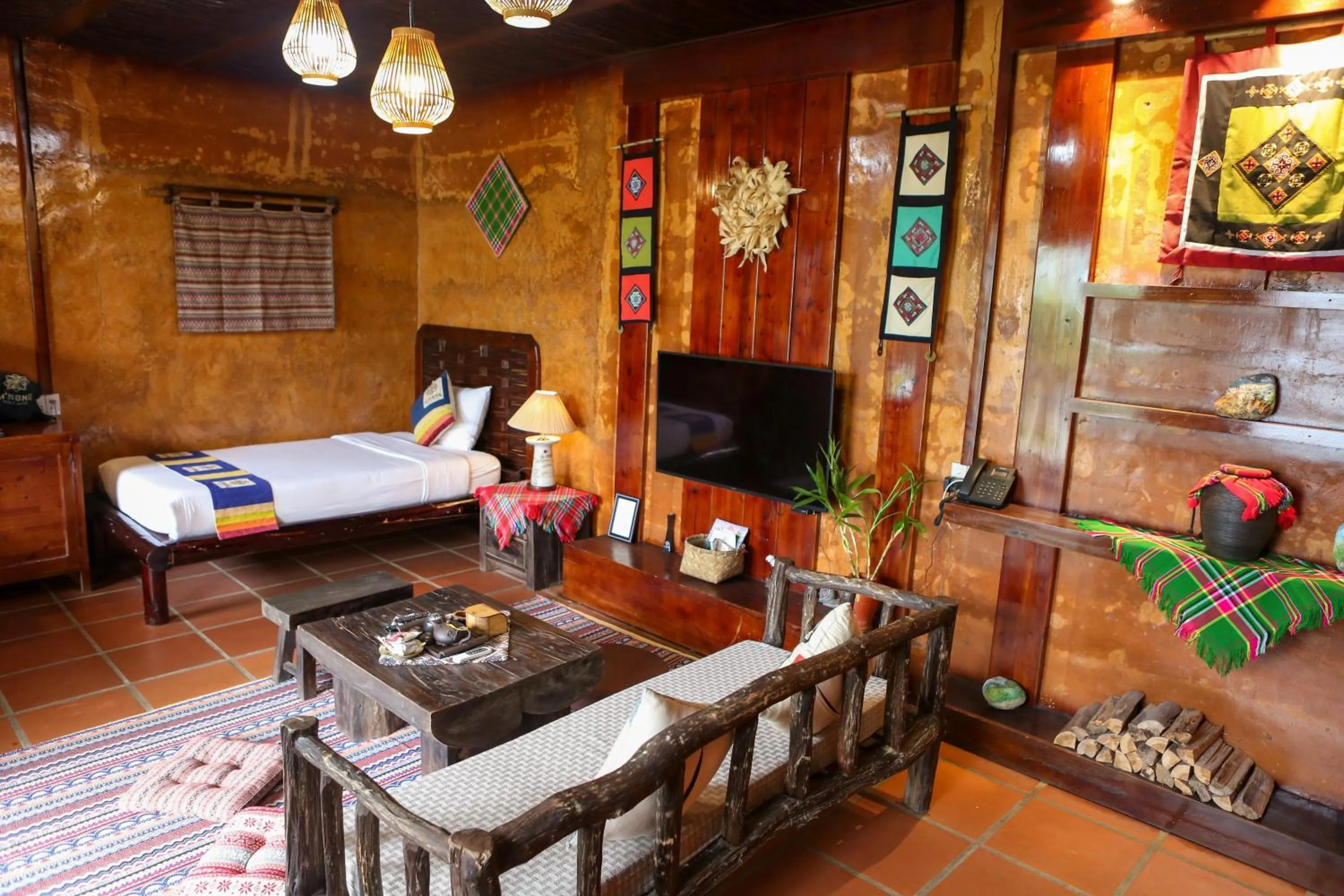 Living room, Bed in H'mong Village Resort Ha Giang