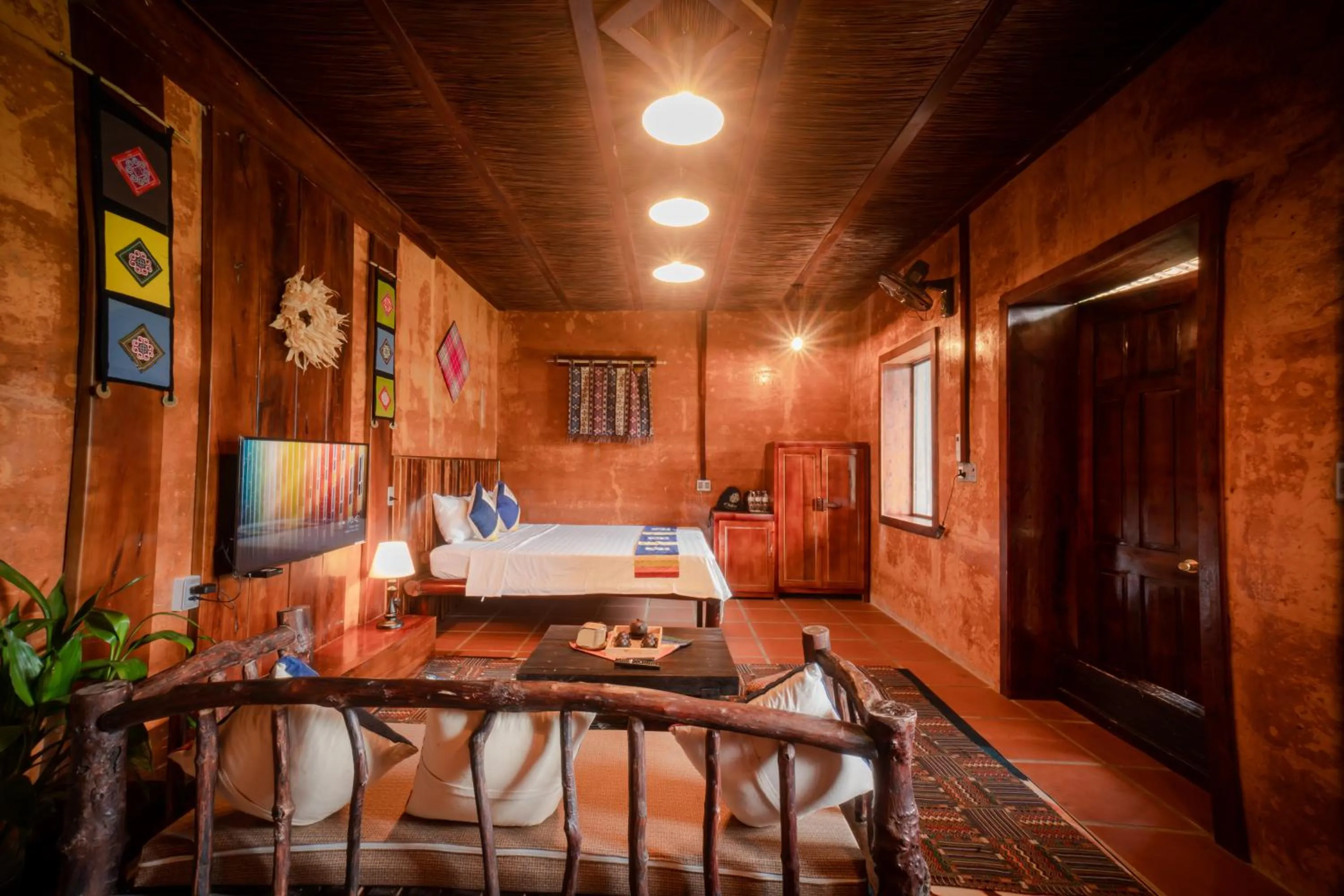 Living room, Bed in H'mong Village Resort Ha Giang