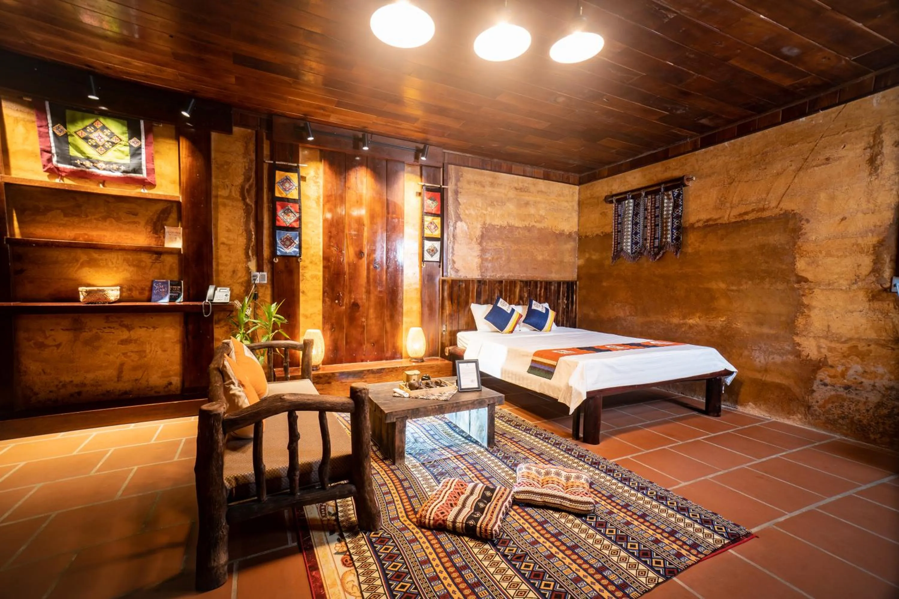 Living room, Bed in H'mong Village Resort Ha Giang