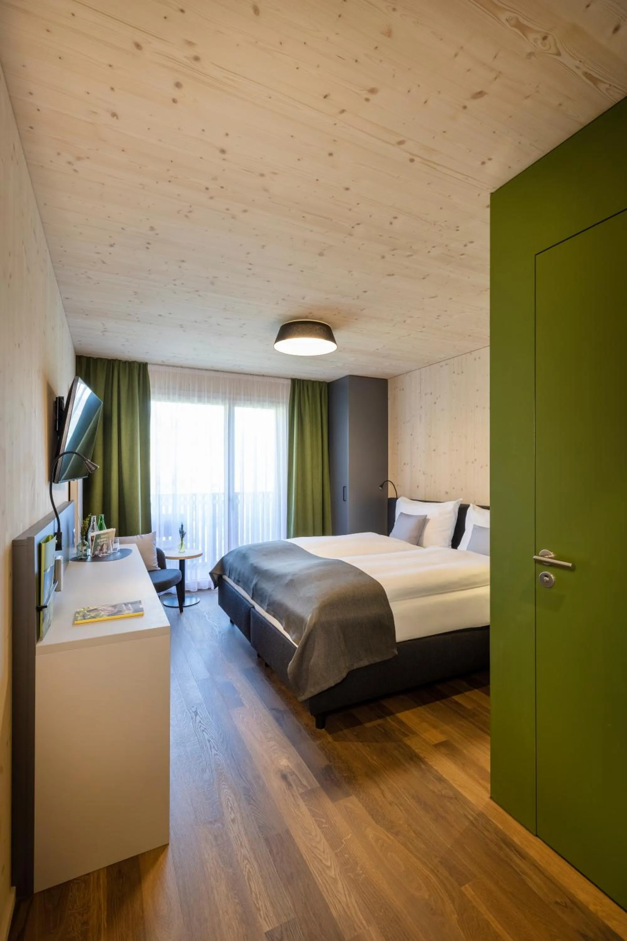 Photo of the whole room, Bed in JUFA Hotel Savognin