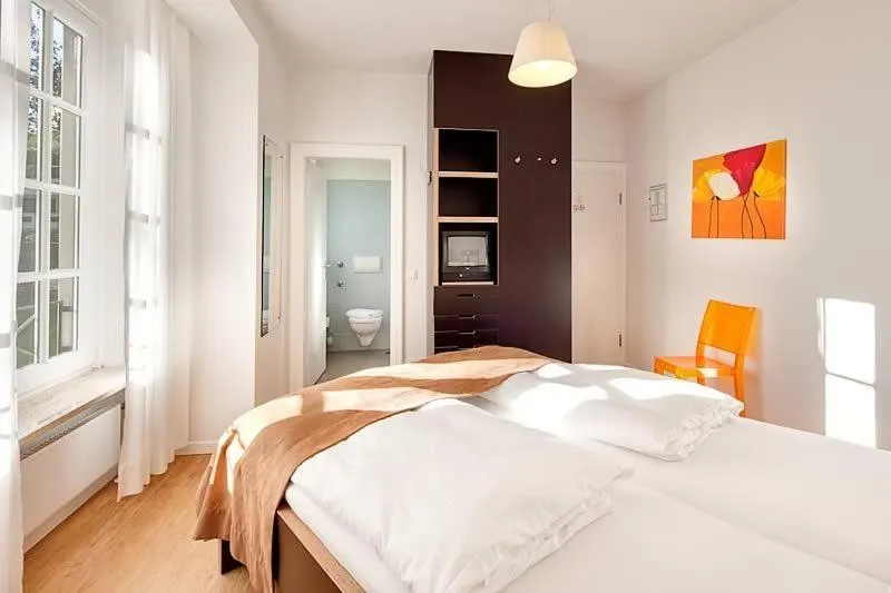 Bed in Das Gästehaus der Elb Lounge "Self Check In"