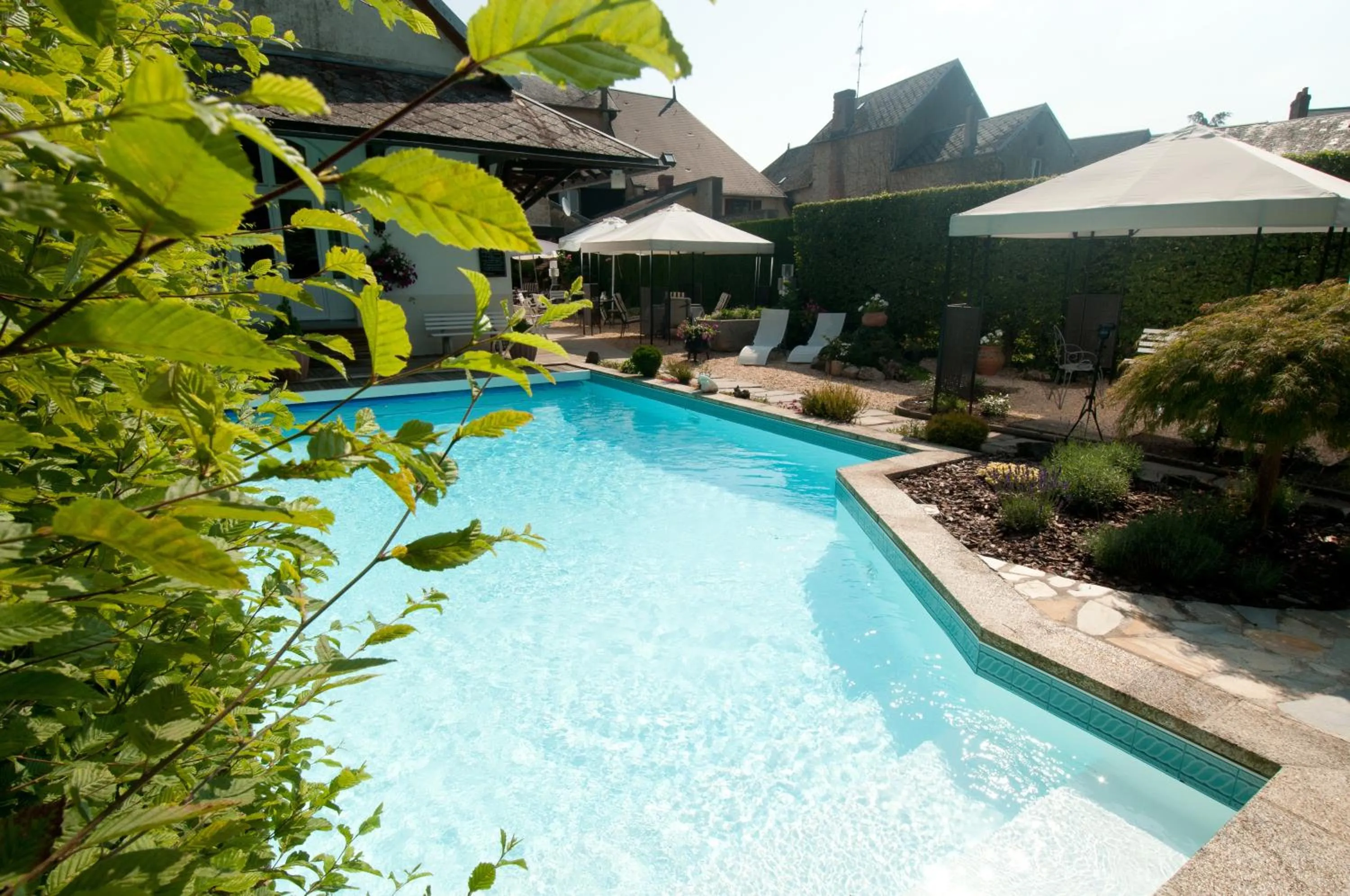 Swimming pool in Logis Hotel Restaurant Nougier
