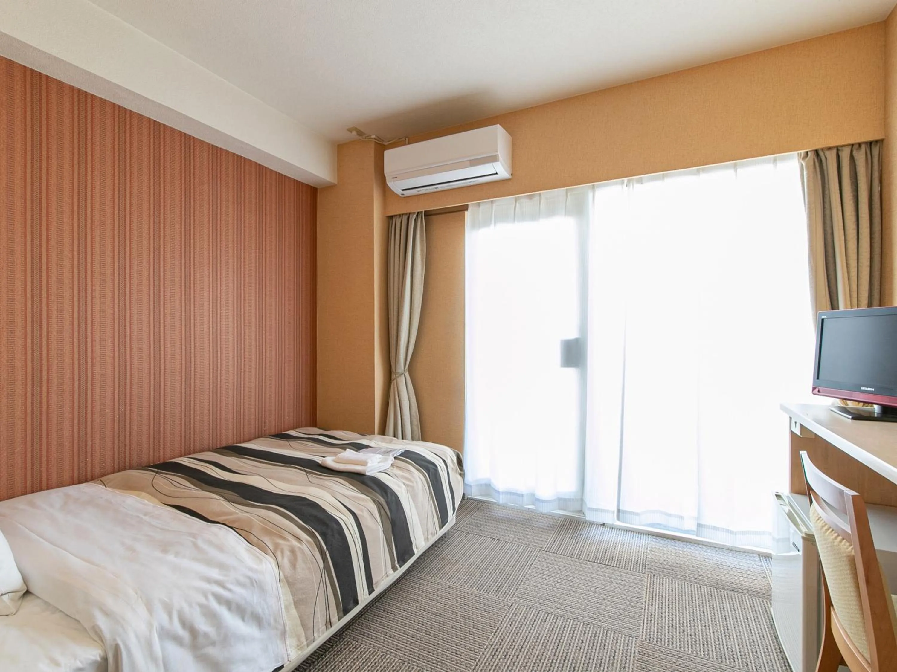 Bed in Tabist Arc Inn Matsumi