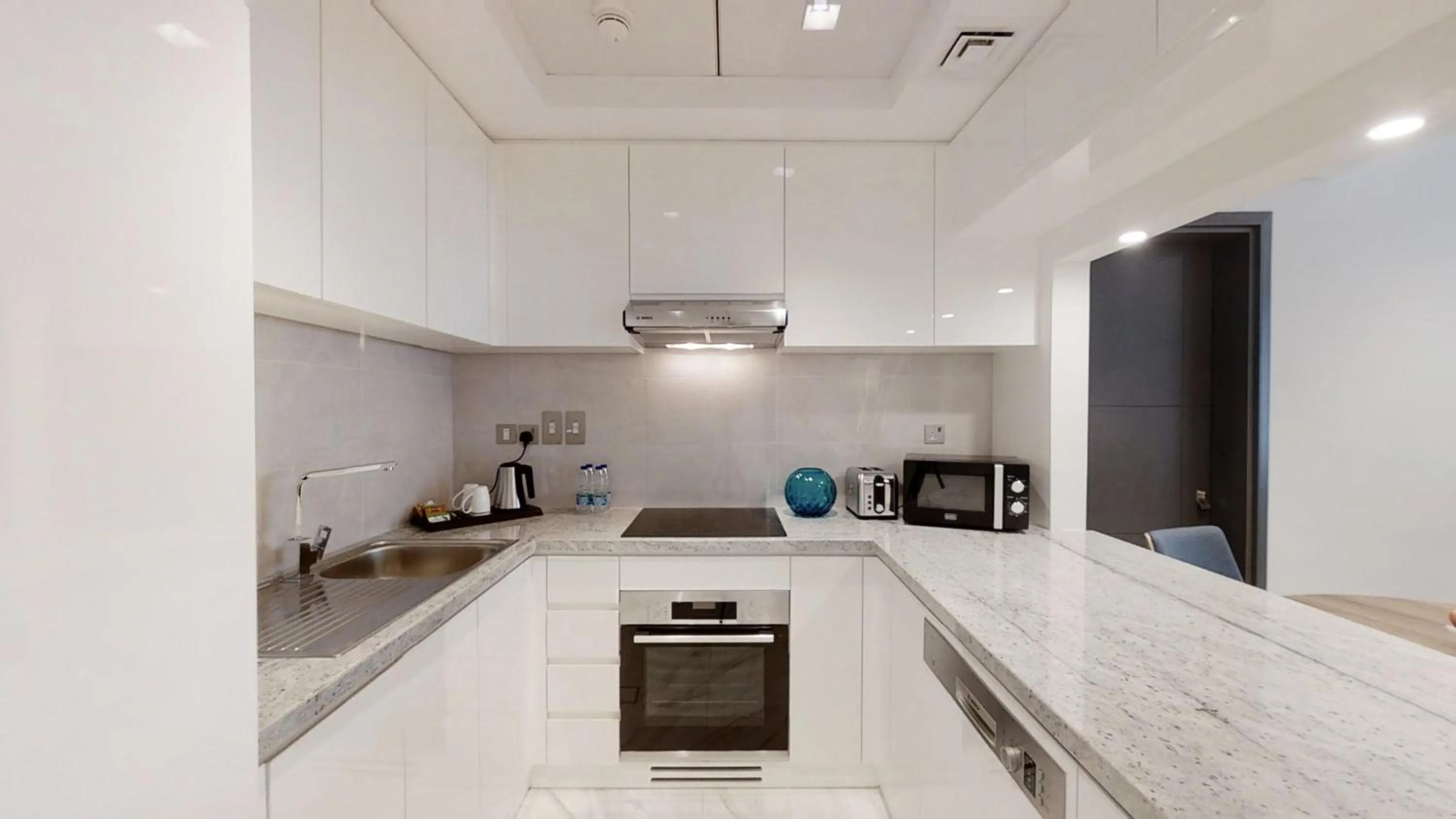 Kitchen or kitchenette in SUHA Mina Rashid Hotel Apartments
