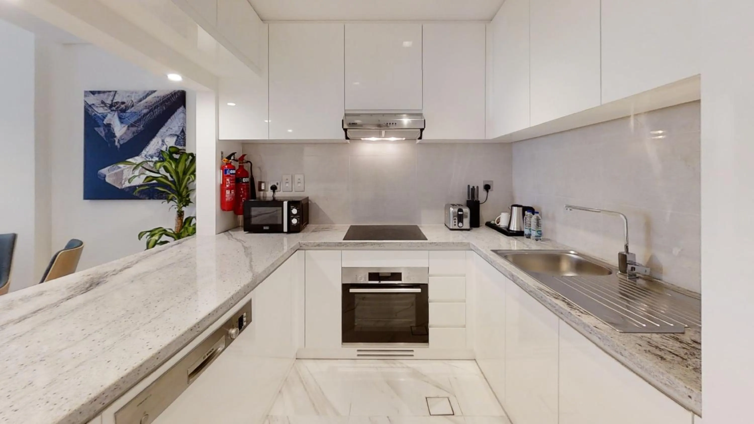 Kitchen or kitchenette in SUHA Mina Rashid Hotel Apartments