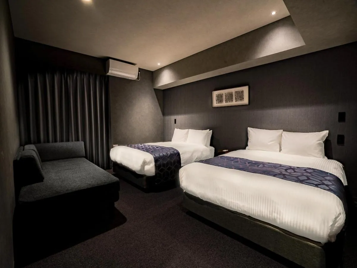 Bed in Randor Hotel Namba Osaka Suites