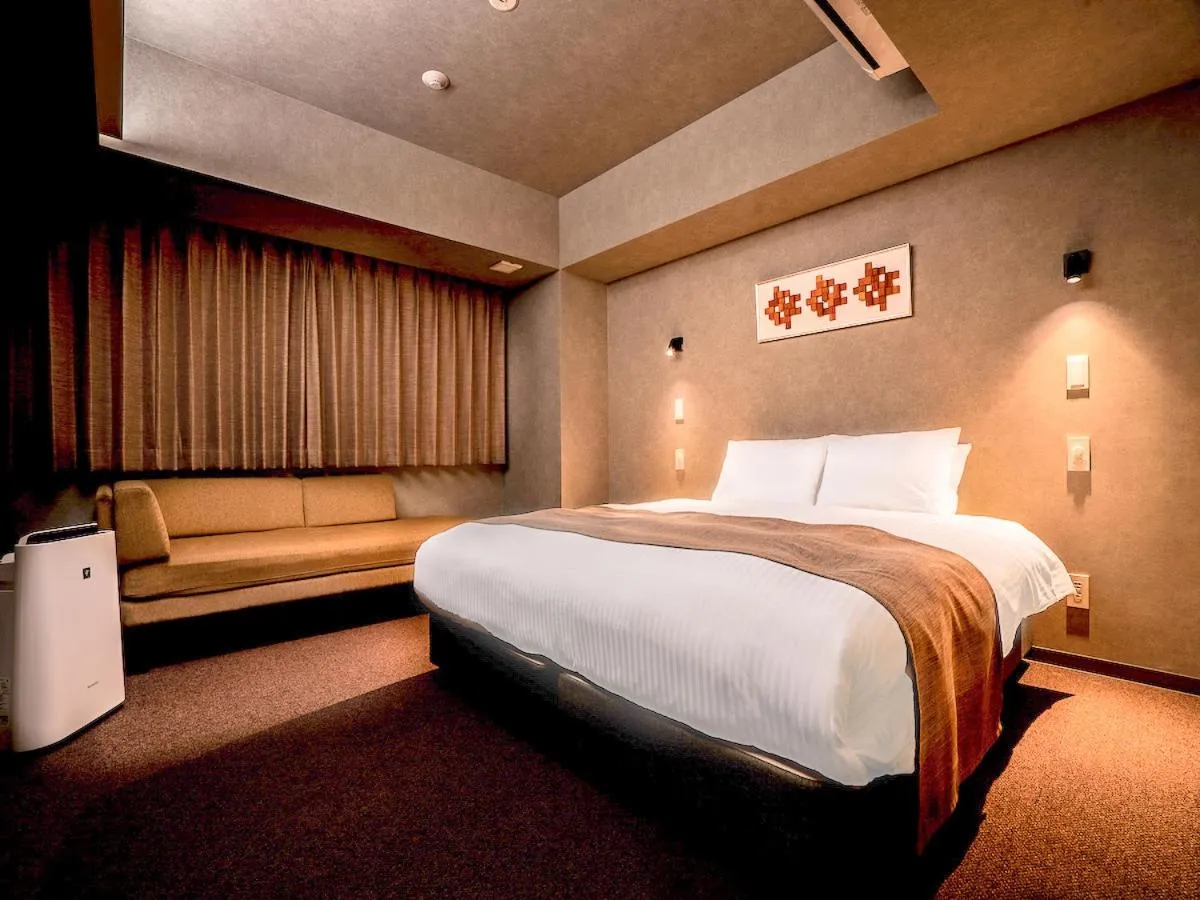 Bed in Randor Hotel Namba Osaka Suites