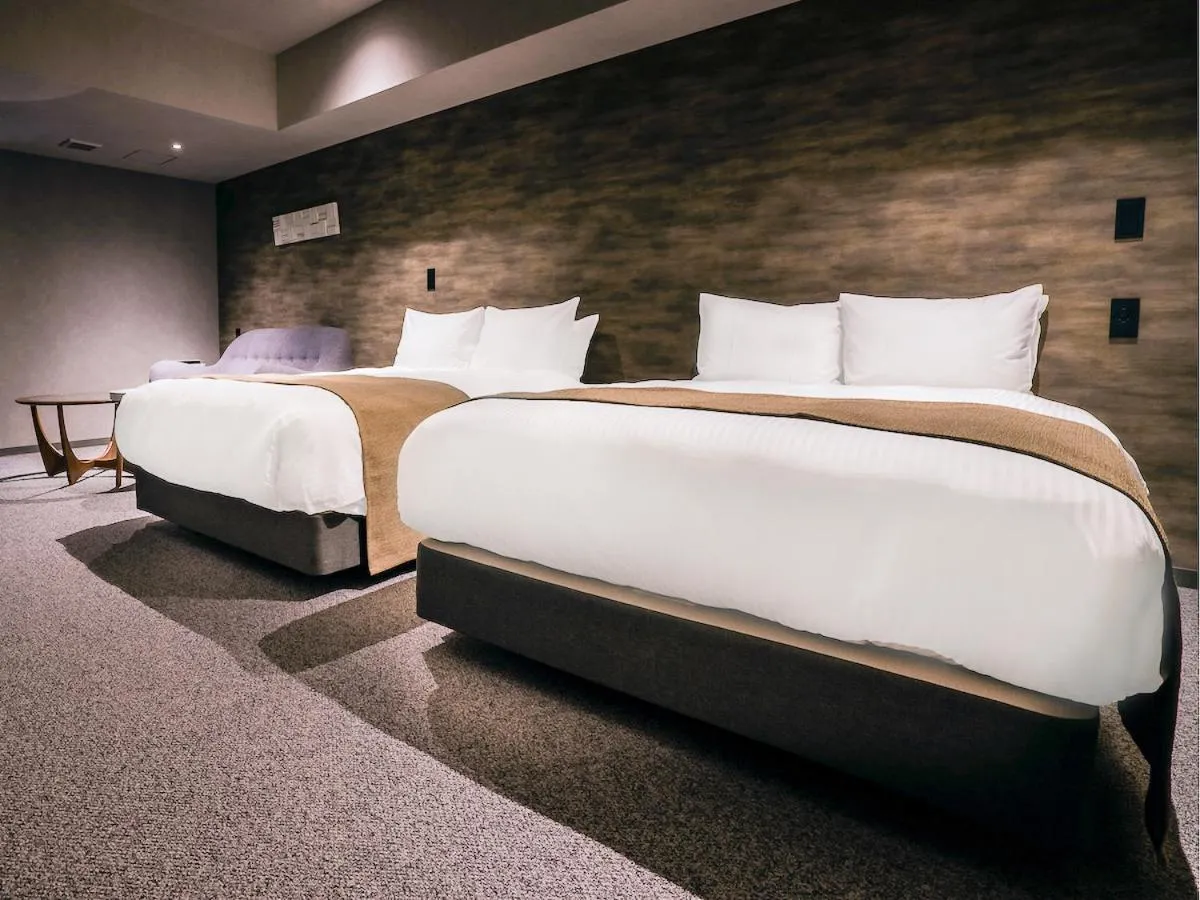 Bed in Randor Hotel Namba Osaka Suites