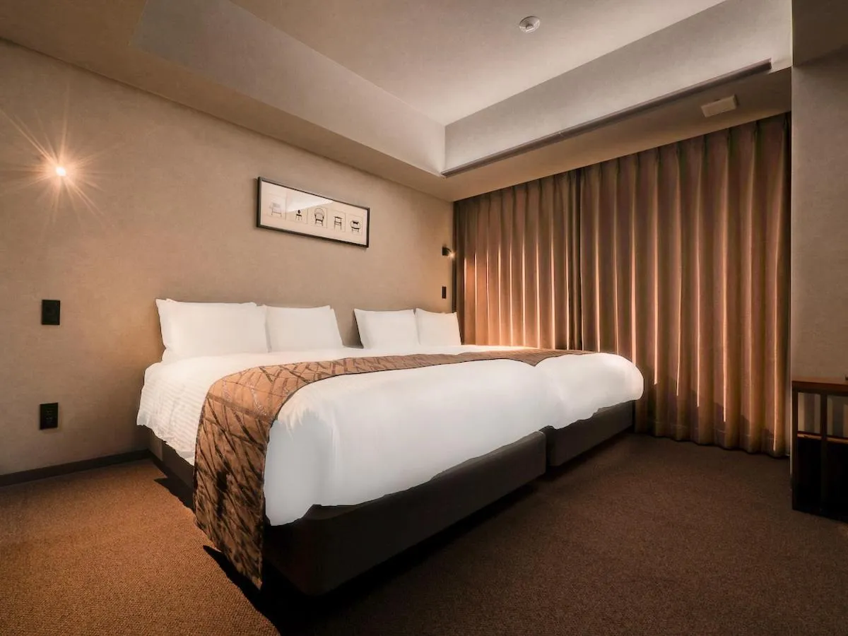 Bed in Randor Hotel Namba Osaka Suites