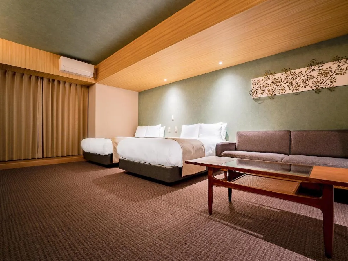 Bed in Randor Hotel Namba Osaka Suites