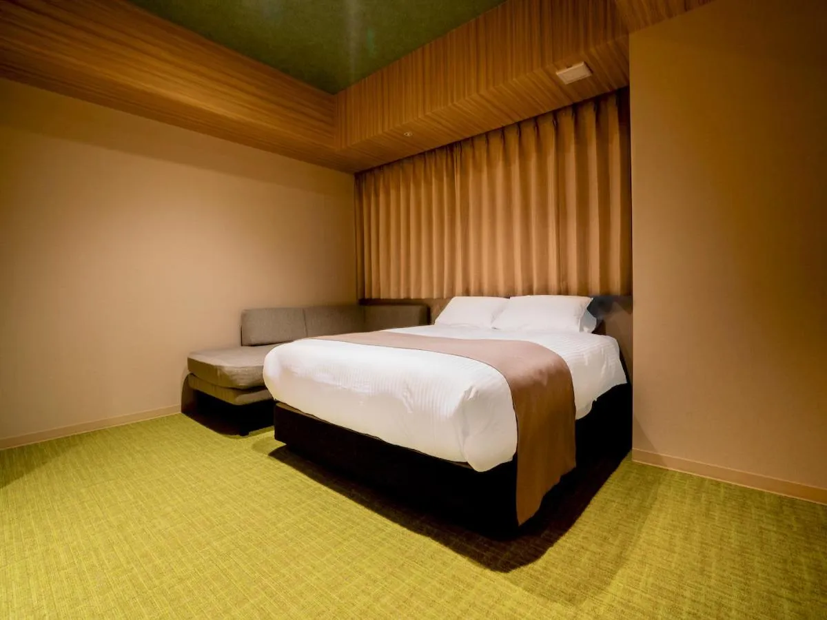 Bed in Randor Hotel Namba Osaka Suites
