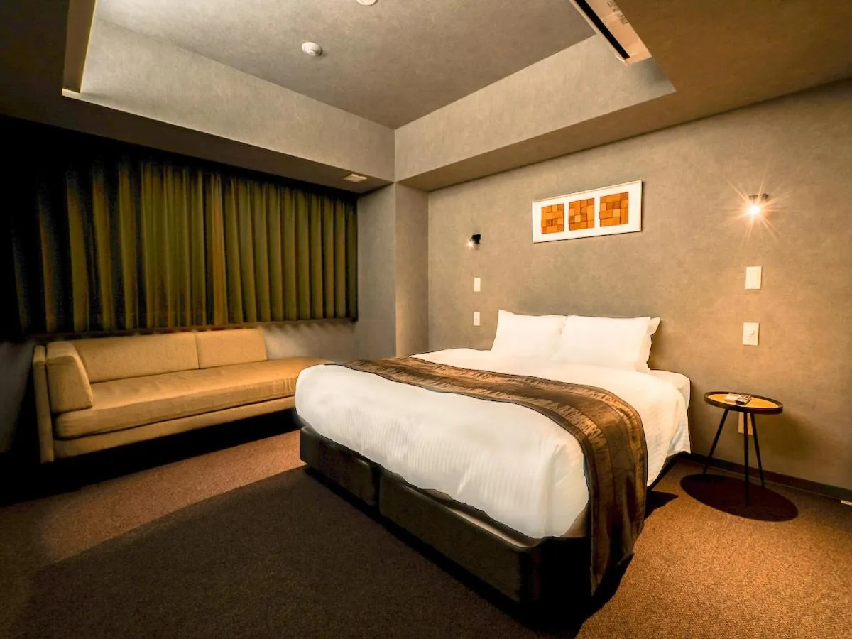 Bed in Randor Hotel Namba Osaka Suites