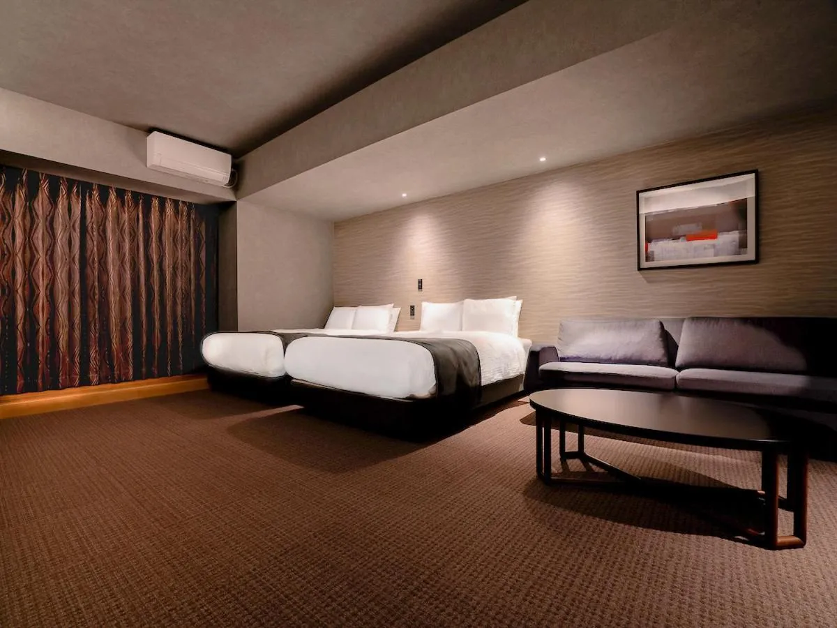 Bed in Randor Hotel Namba Osaka Suites