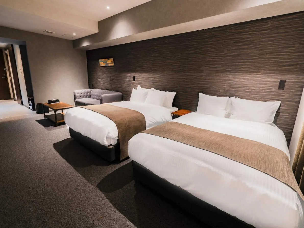 Bed in Randor Hotel Namba Osaka Suites