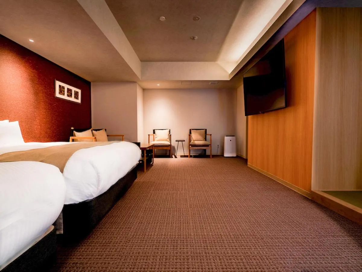 Bed in Randor Hotel Namba Osaka Suites