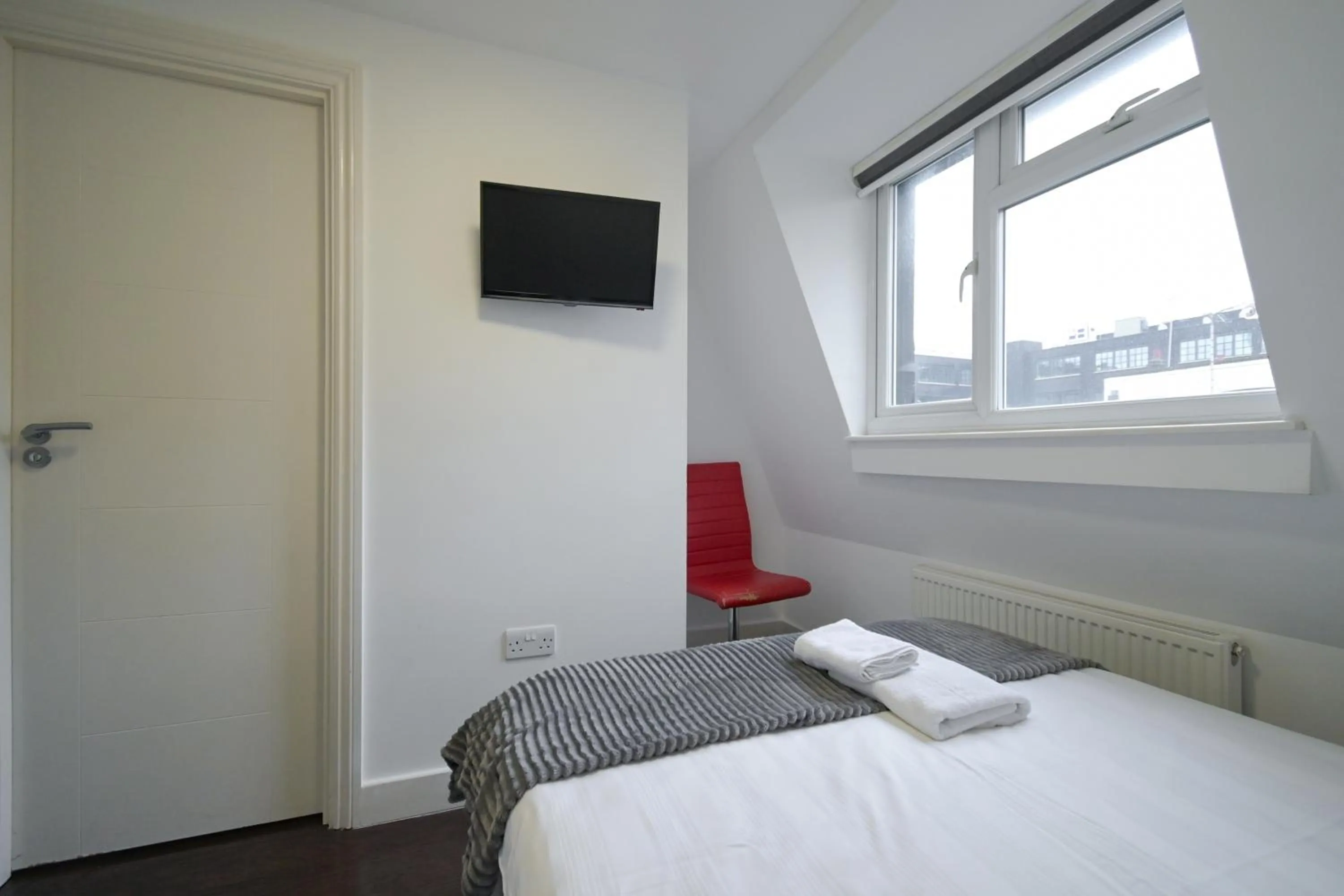 Bed in Charlotte Street Rooms by News Hotel