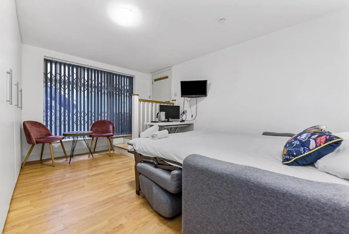 Seating area in Charlotte Street Rooms by News Hotel