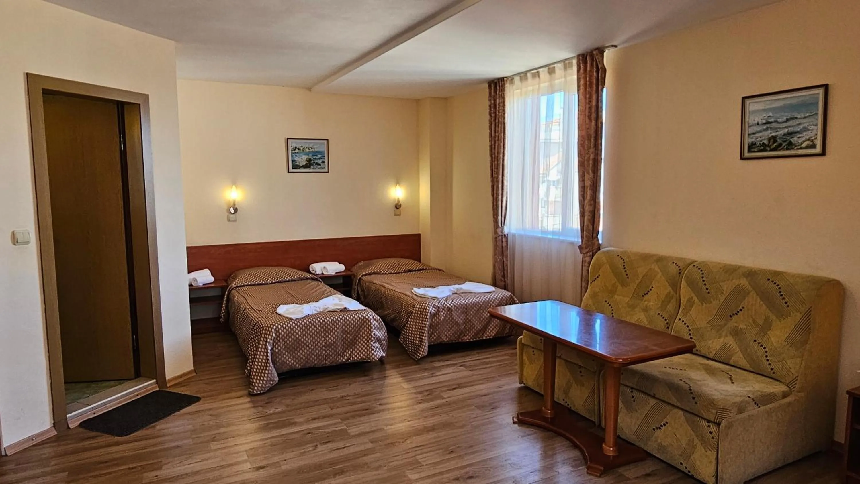 Bed in Caprice Family Hotel