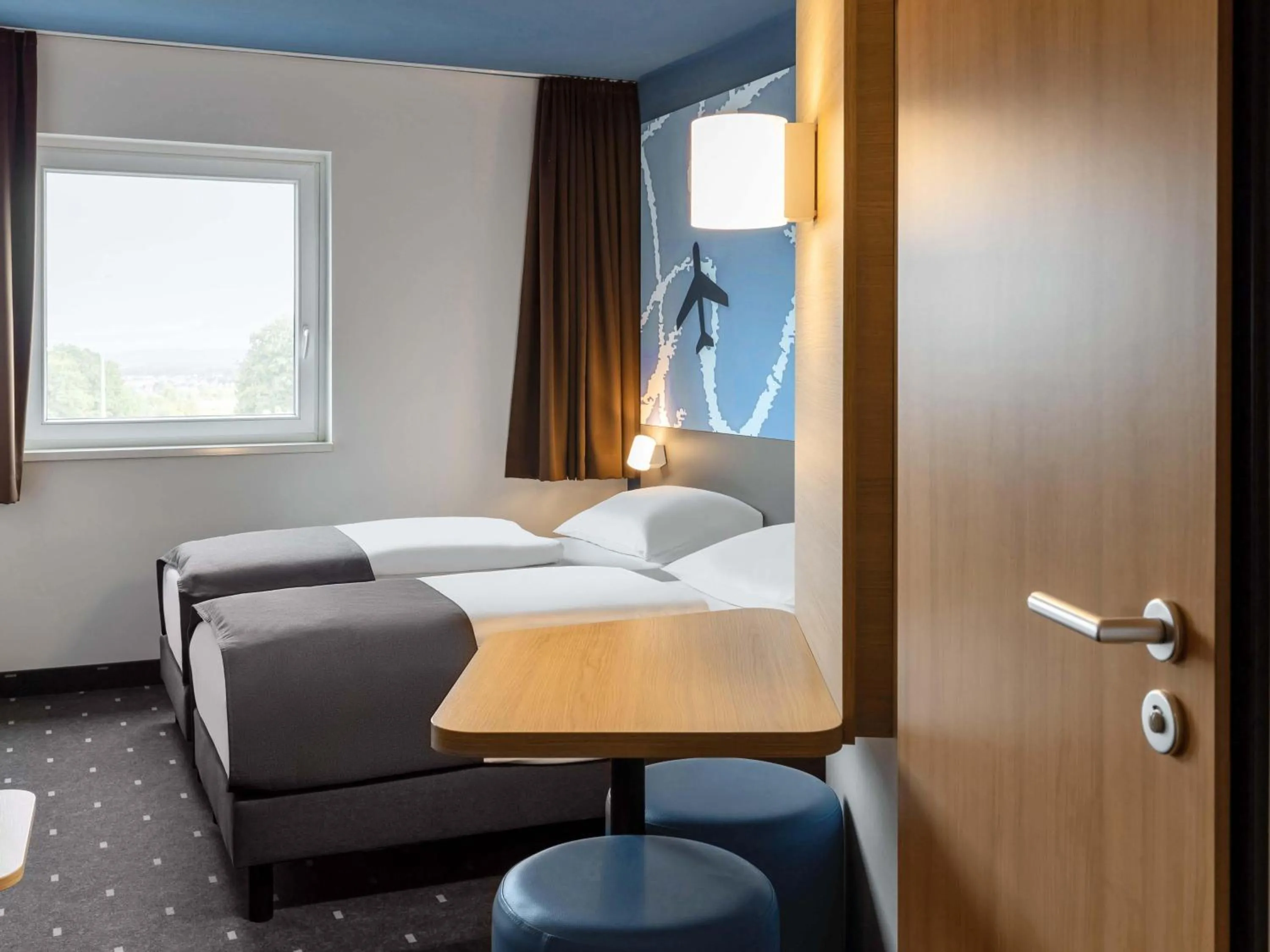 Photo of the whole room, Bed in B&B HOTEL Frankfurt-Hahn Airport