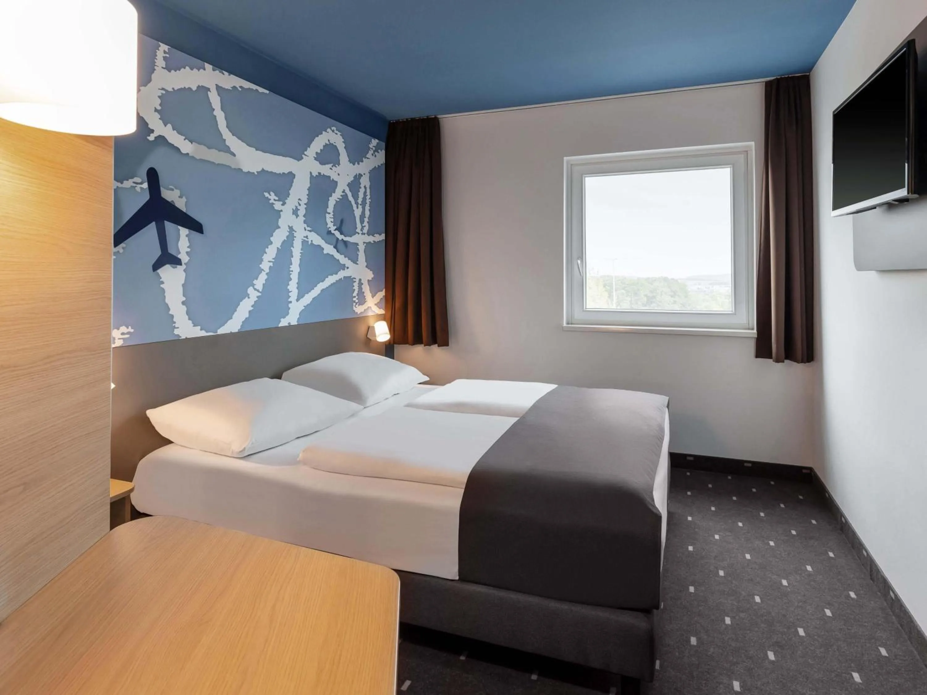 Photo of the whole room, Bed in B&B HOTEL Frankfurt-Hahn Airport