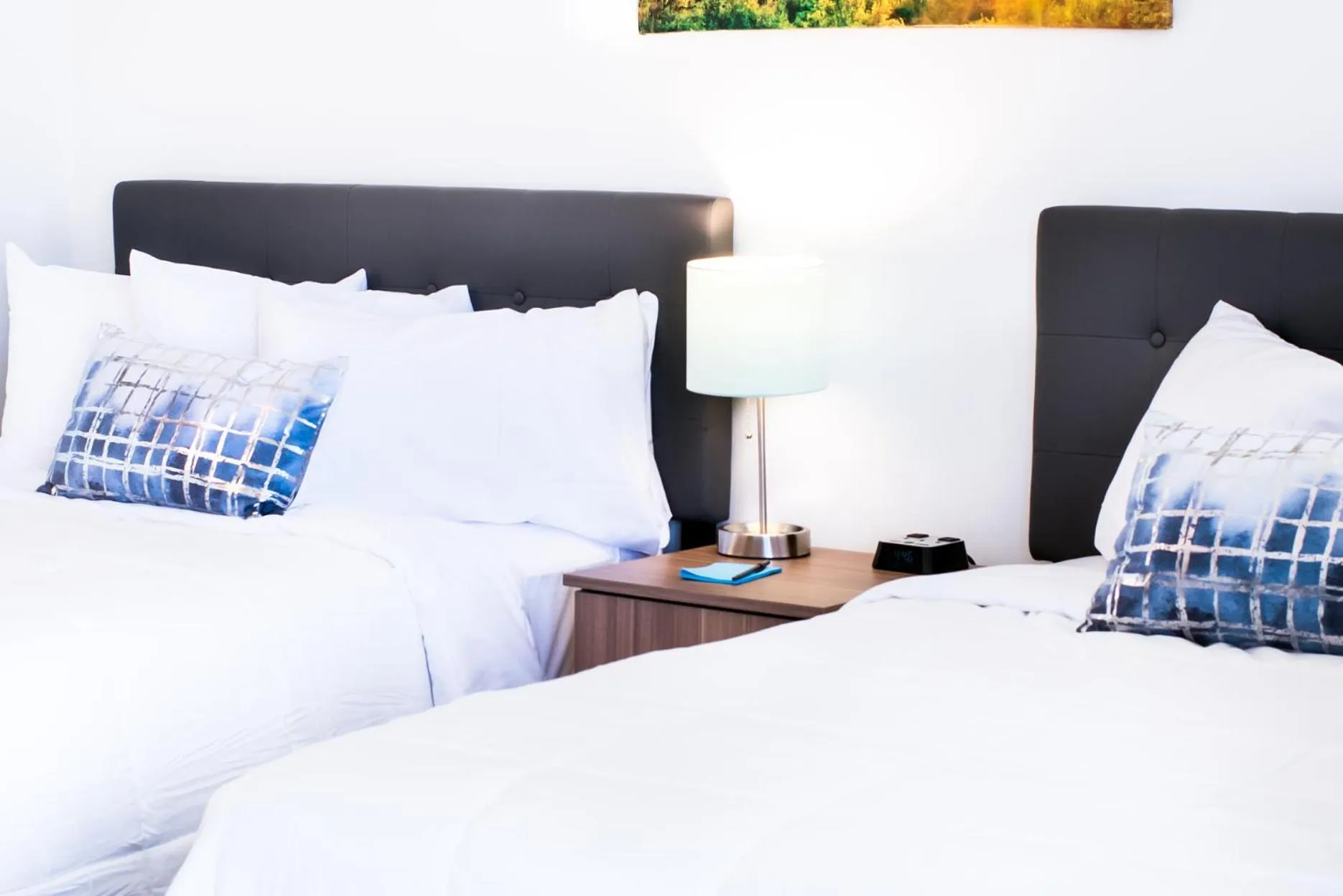 Bed in Blue Sage Inn & Suites