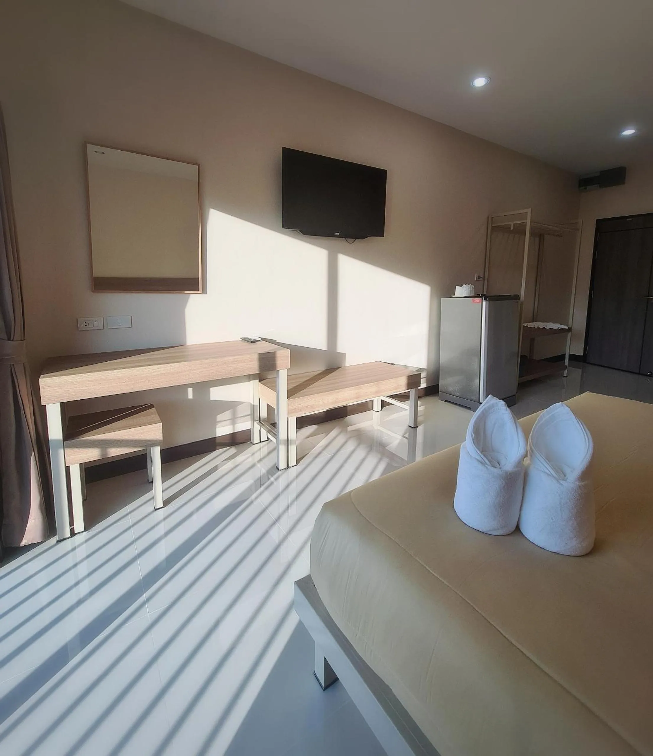 Bed in Grand Maihom Hotel