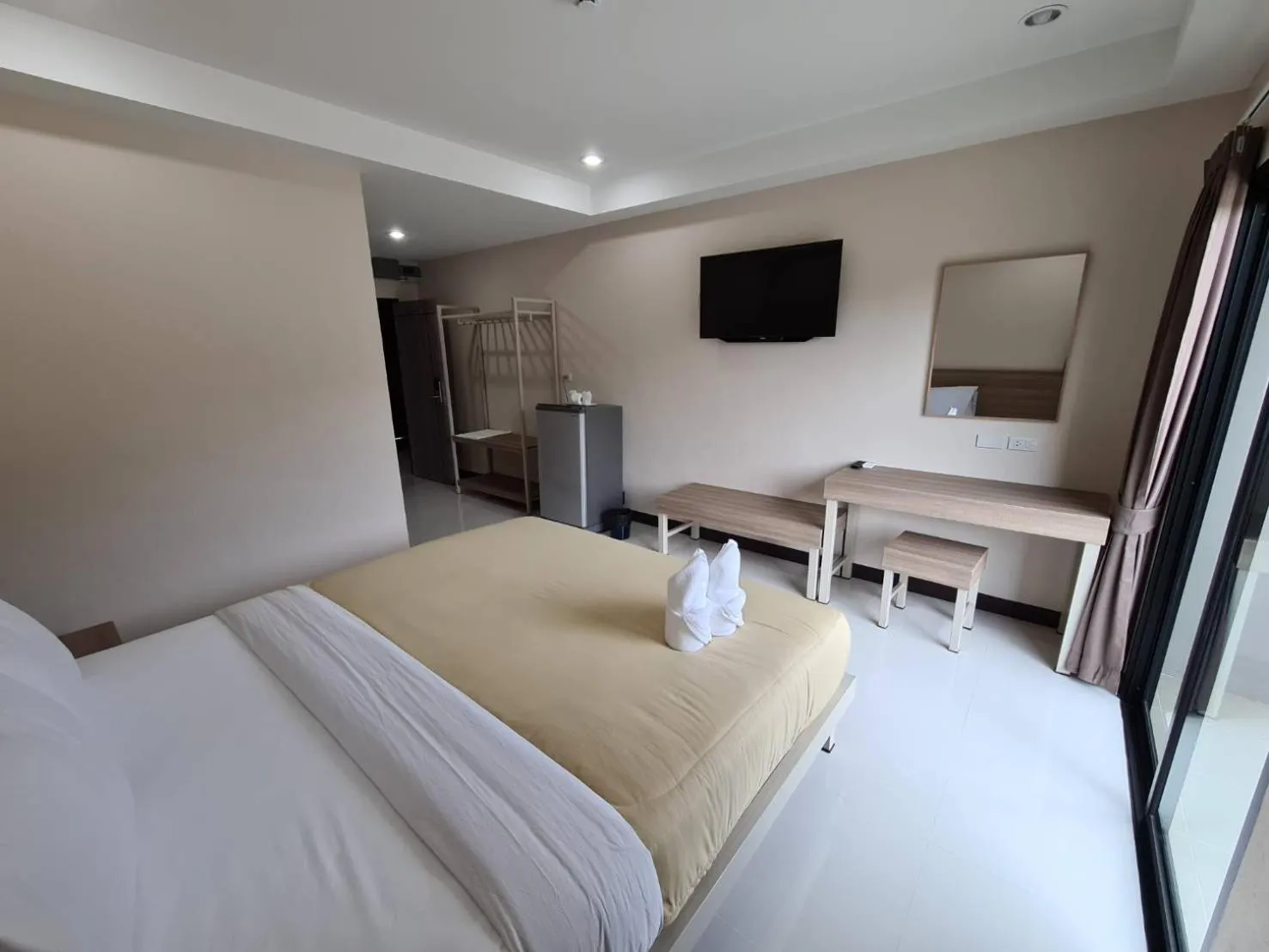 Bed in Grand Maihom Hotel