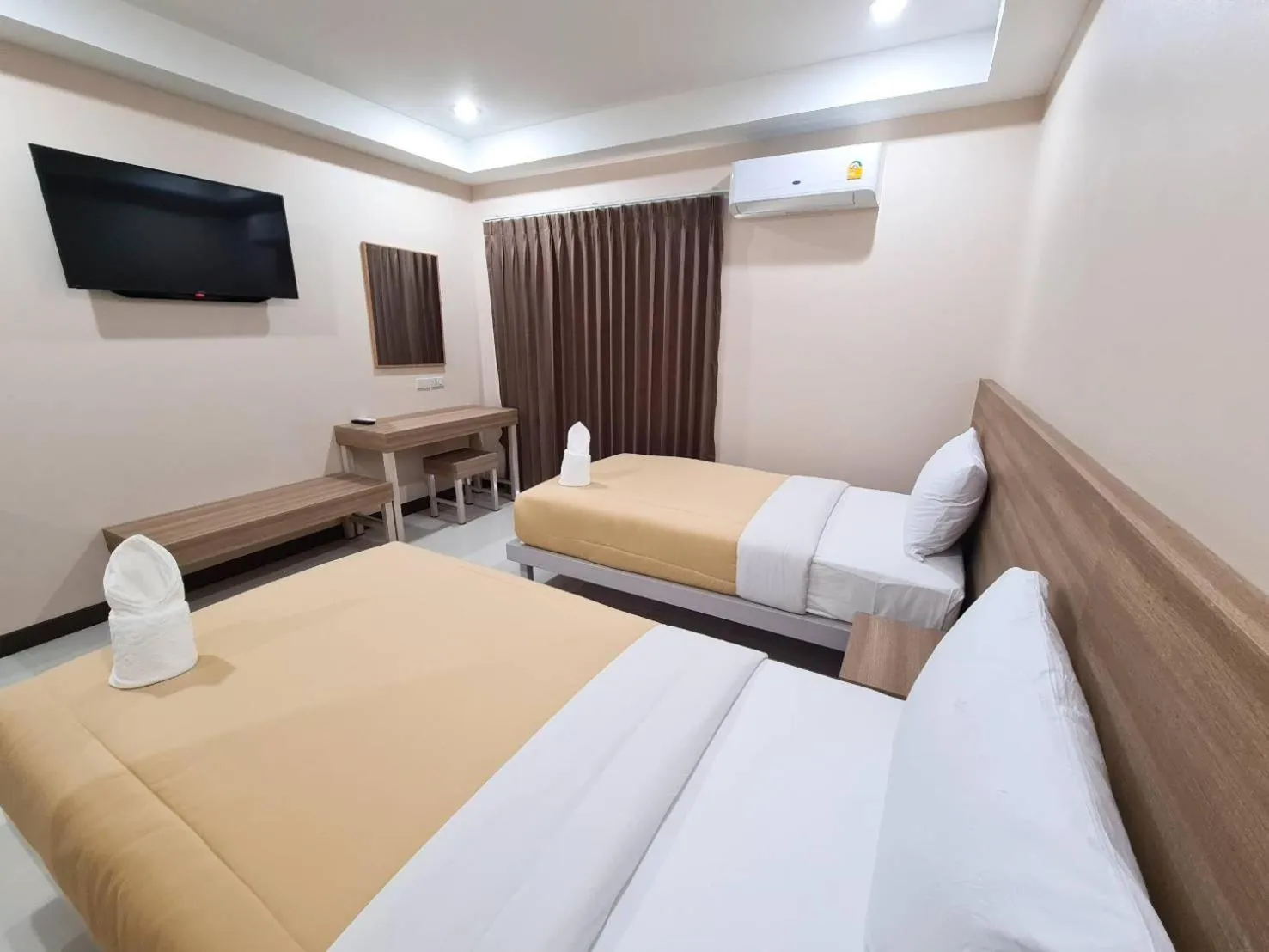 Bed in Grand Maihom Hotel