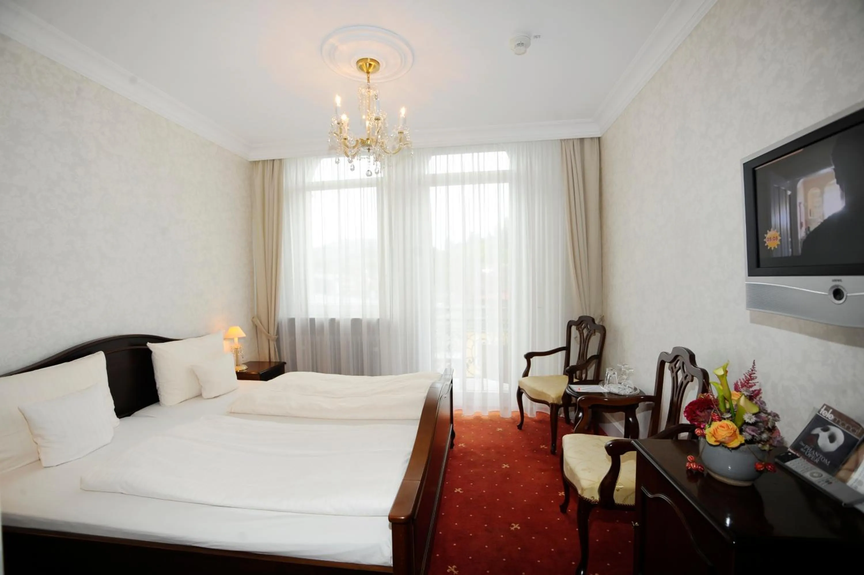 Photo of the whole room, Bed in HELIOPARK Bad Hotel Zum Hirsch